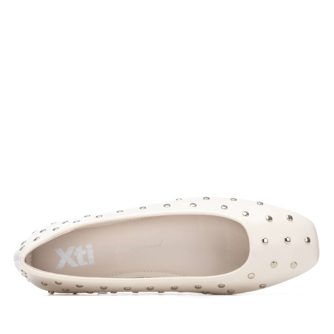 White flat shoe with silver studded details