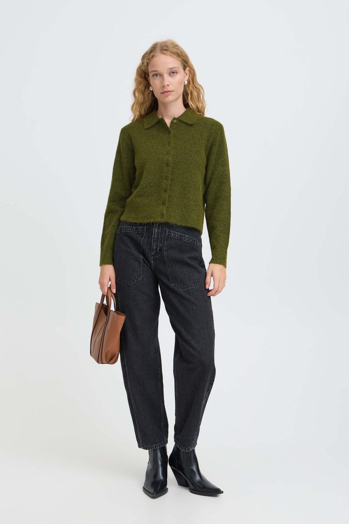 Model wearing the b.young Minua olive green cardigan with black barrel-leg jeans