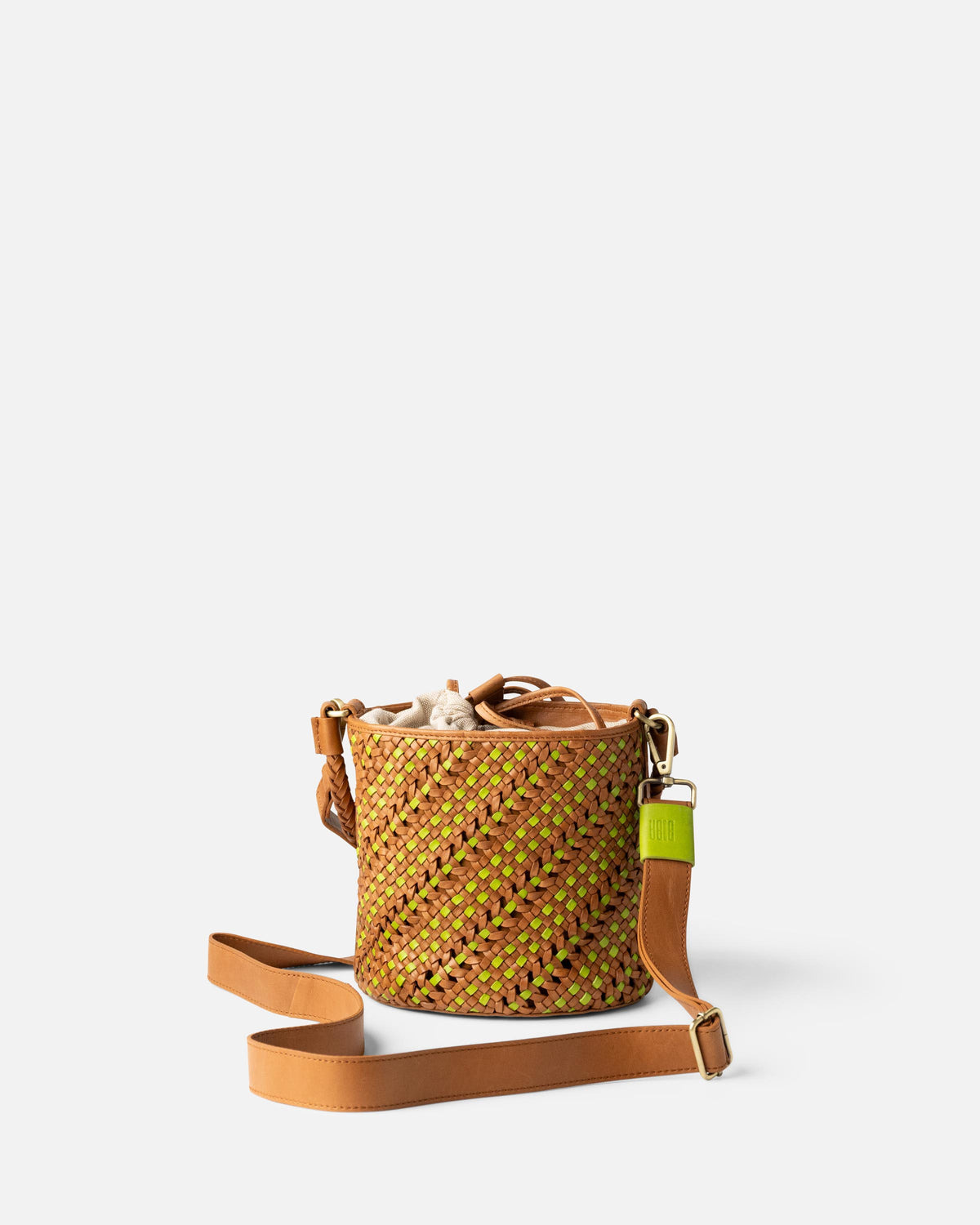 A small woven bucket bag with a tan leather shoulder strap, featuring a textured pattern from BIBA