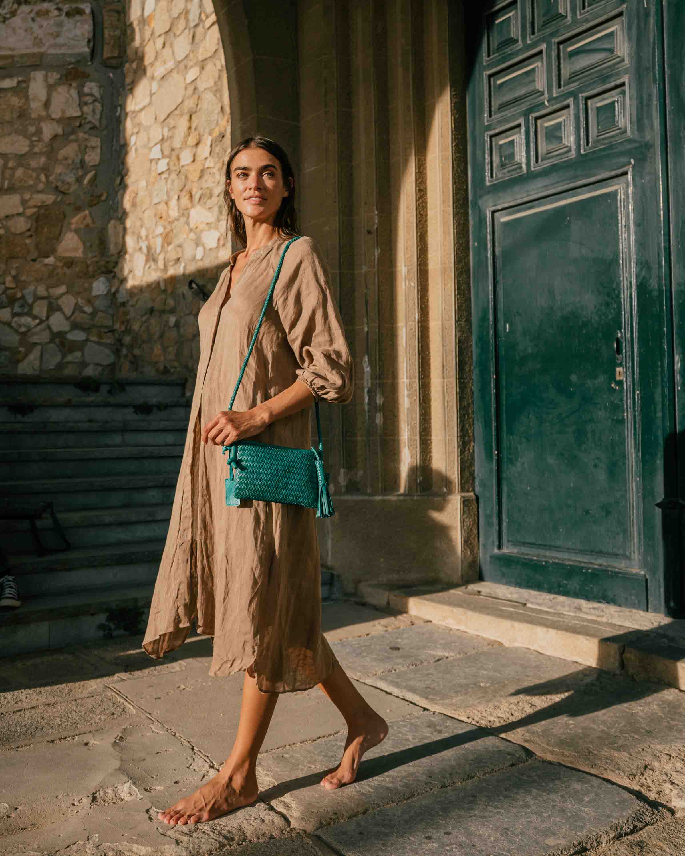 Woman with a teal leather bag