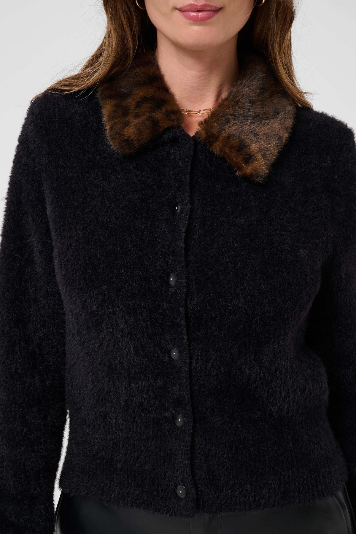 Women’s black cardigan with contrasting brown collar