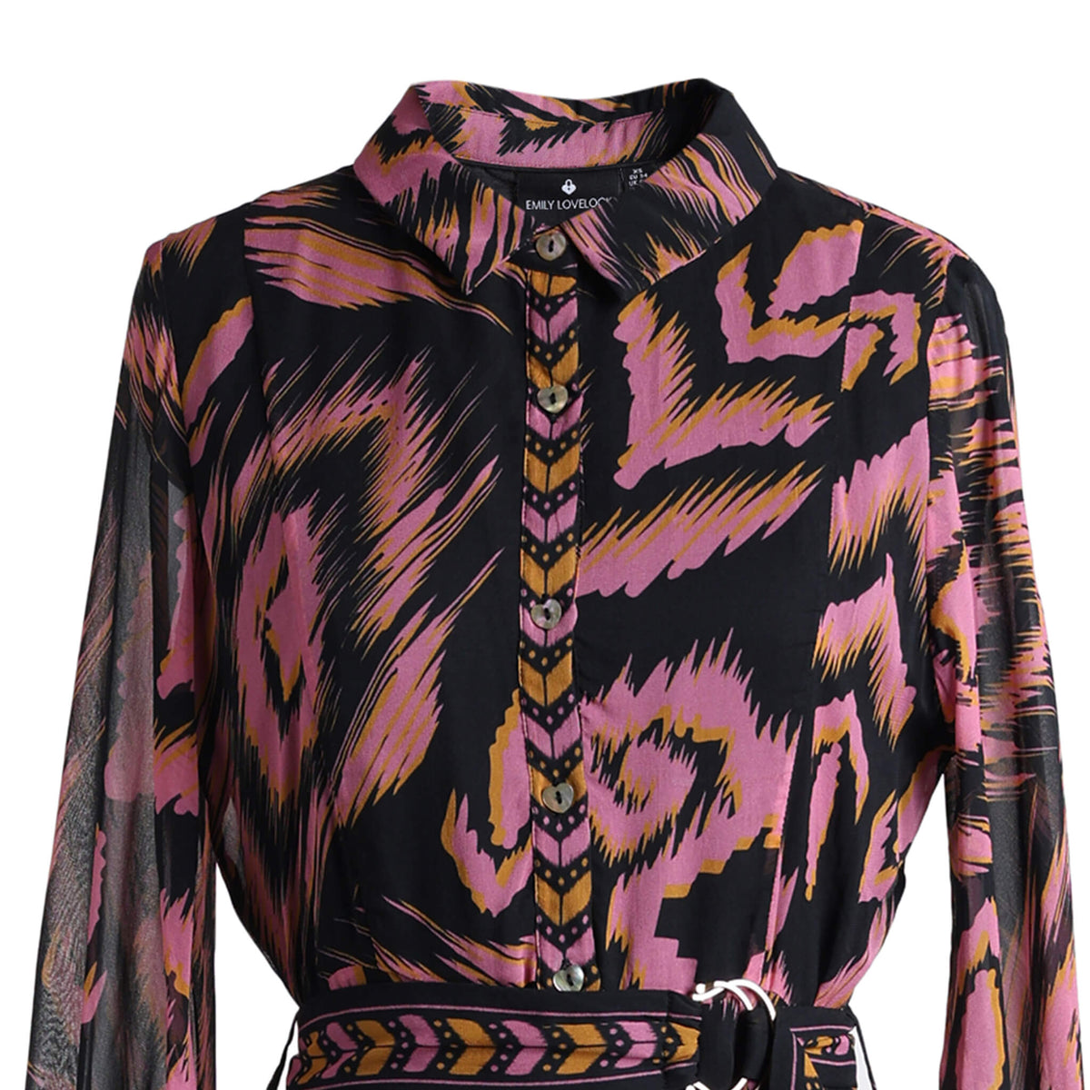Close-up of Emily Lovelock June dress collar, button front and patterned belt