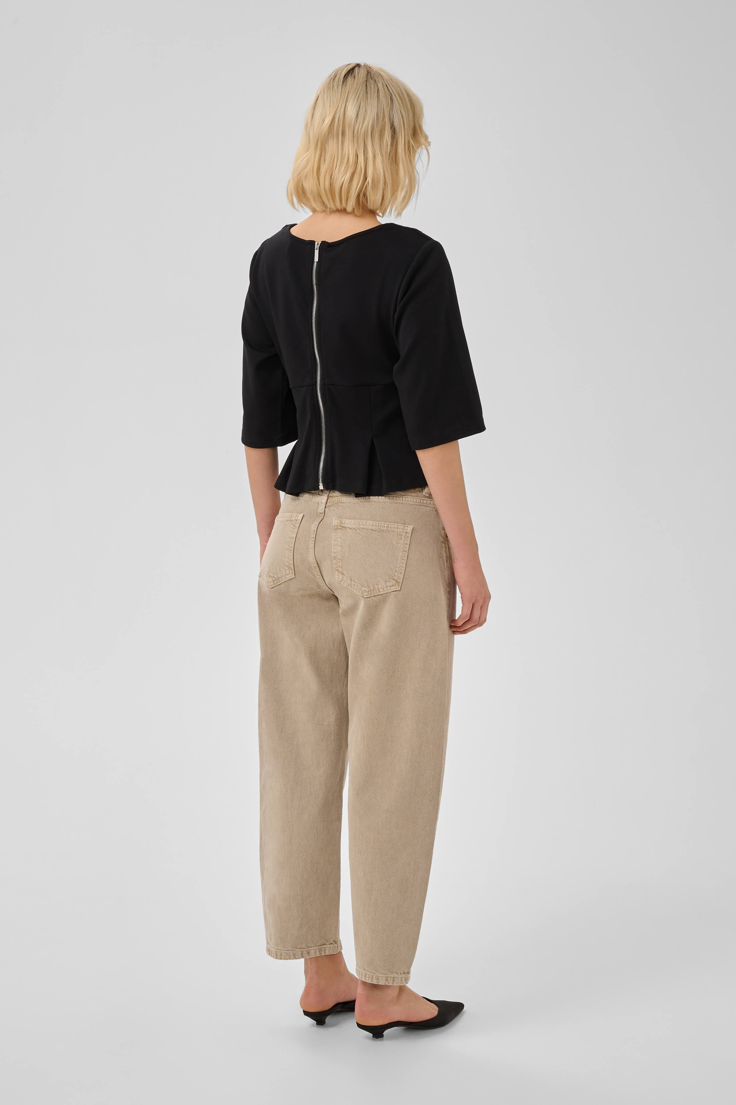 Side view of the MWApir T-shirt showing its tailored silhouette