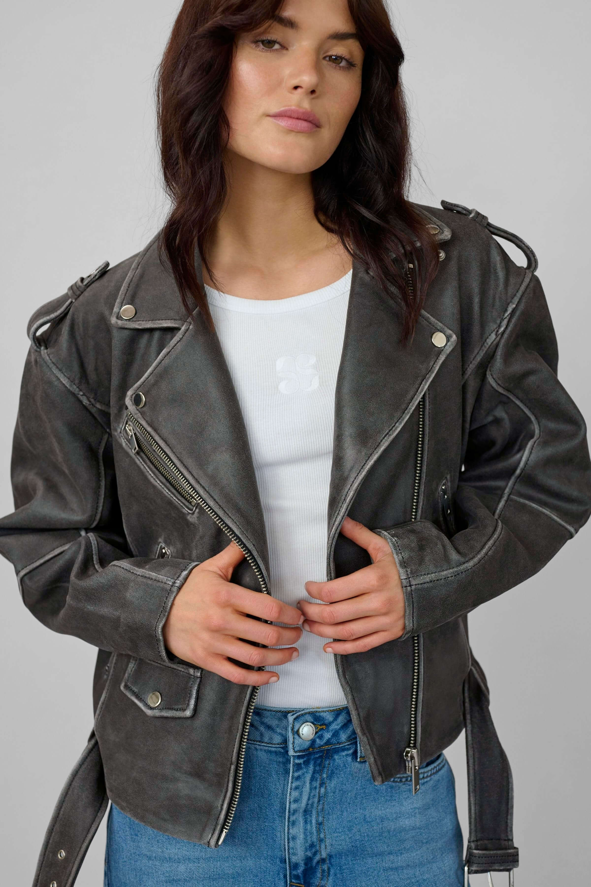 Model wearing the Gilo boxy leather biker jacket