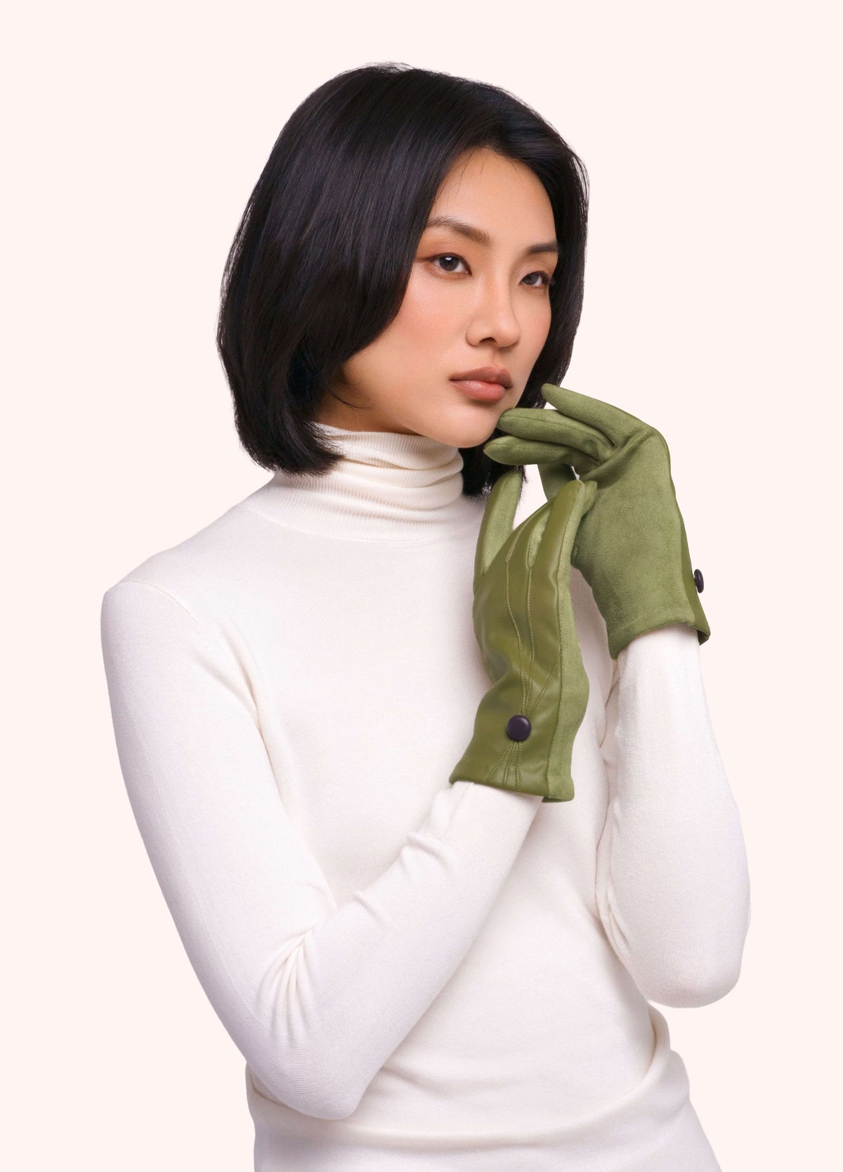 Powder moss-green gloves with black button detail