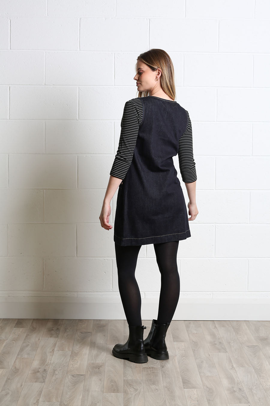 Model wearing the Rant & Rave Helena Pinafore Dress over a striped top