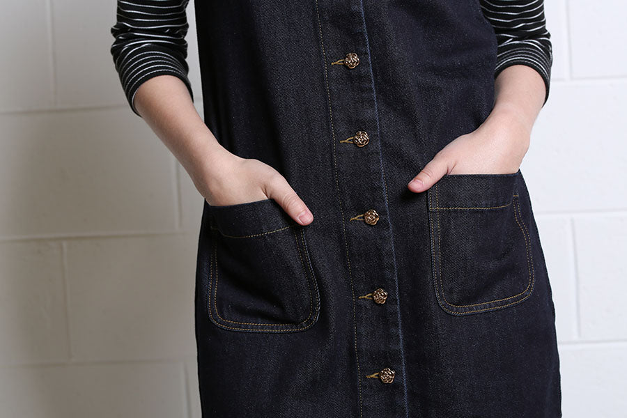 Close-up of the Helena Dress with front patch pockets and contrast stitching