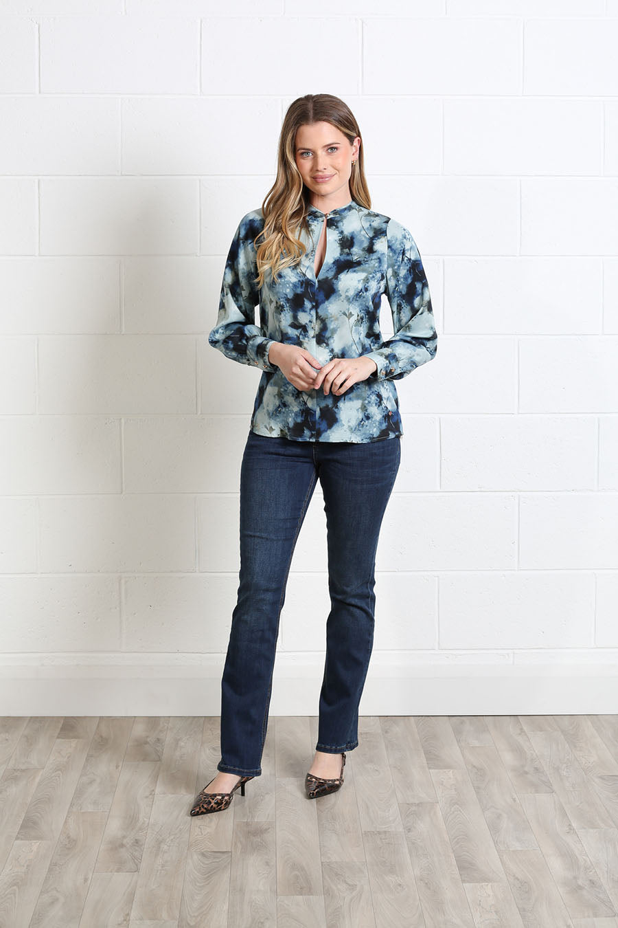 Rant & Rave printed blouse featuring a keyhole neck and decorative clasp