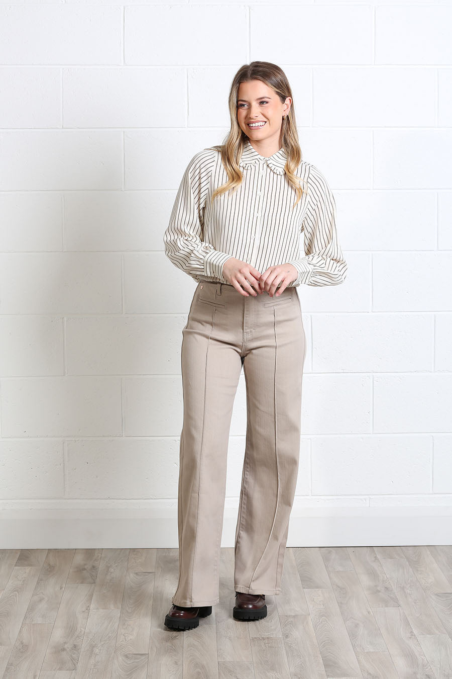 Model wearing the Rant & Rave Stella vertical-striped shirt