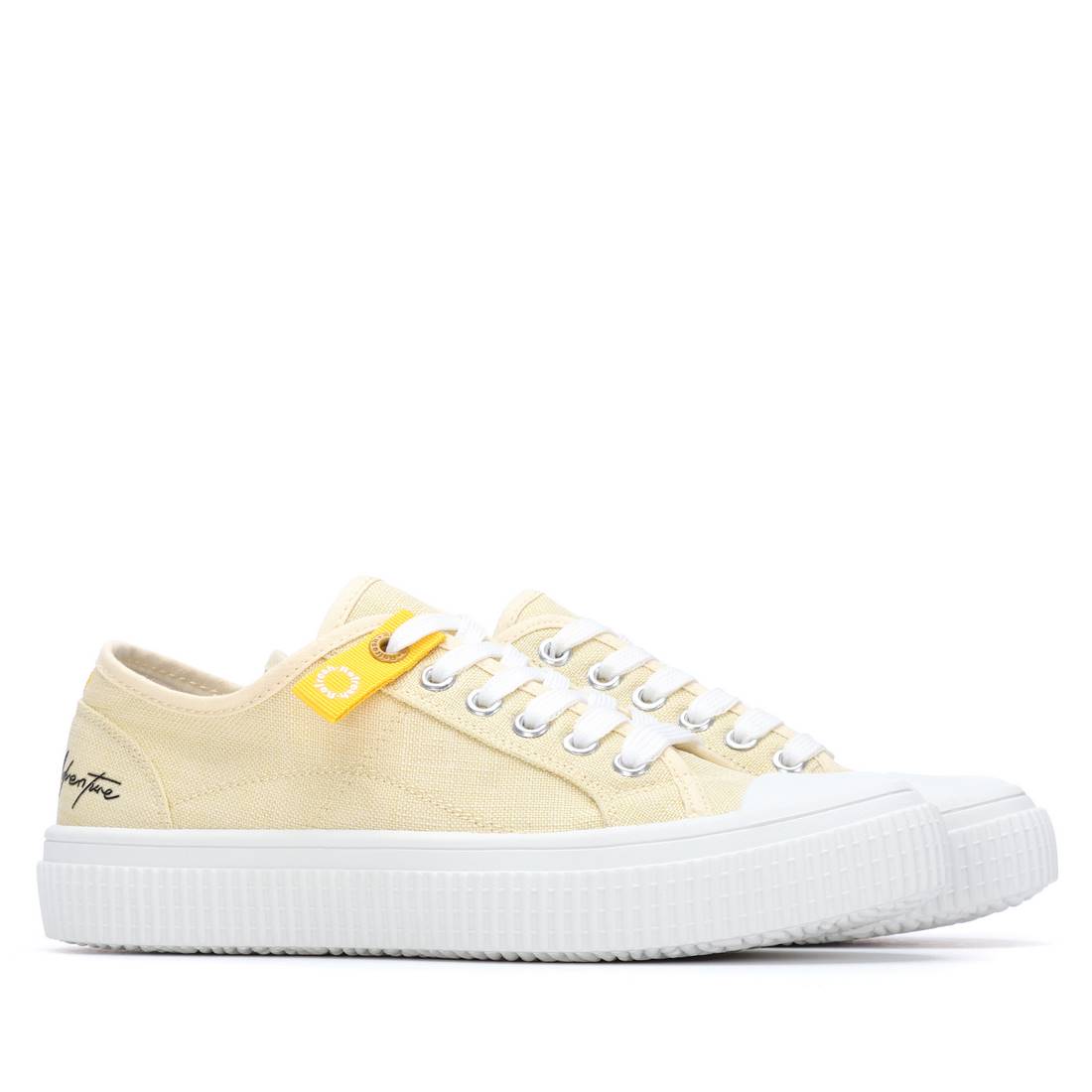 Yellow runners with white laces and sole