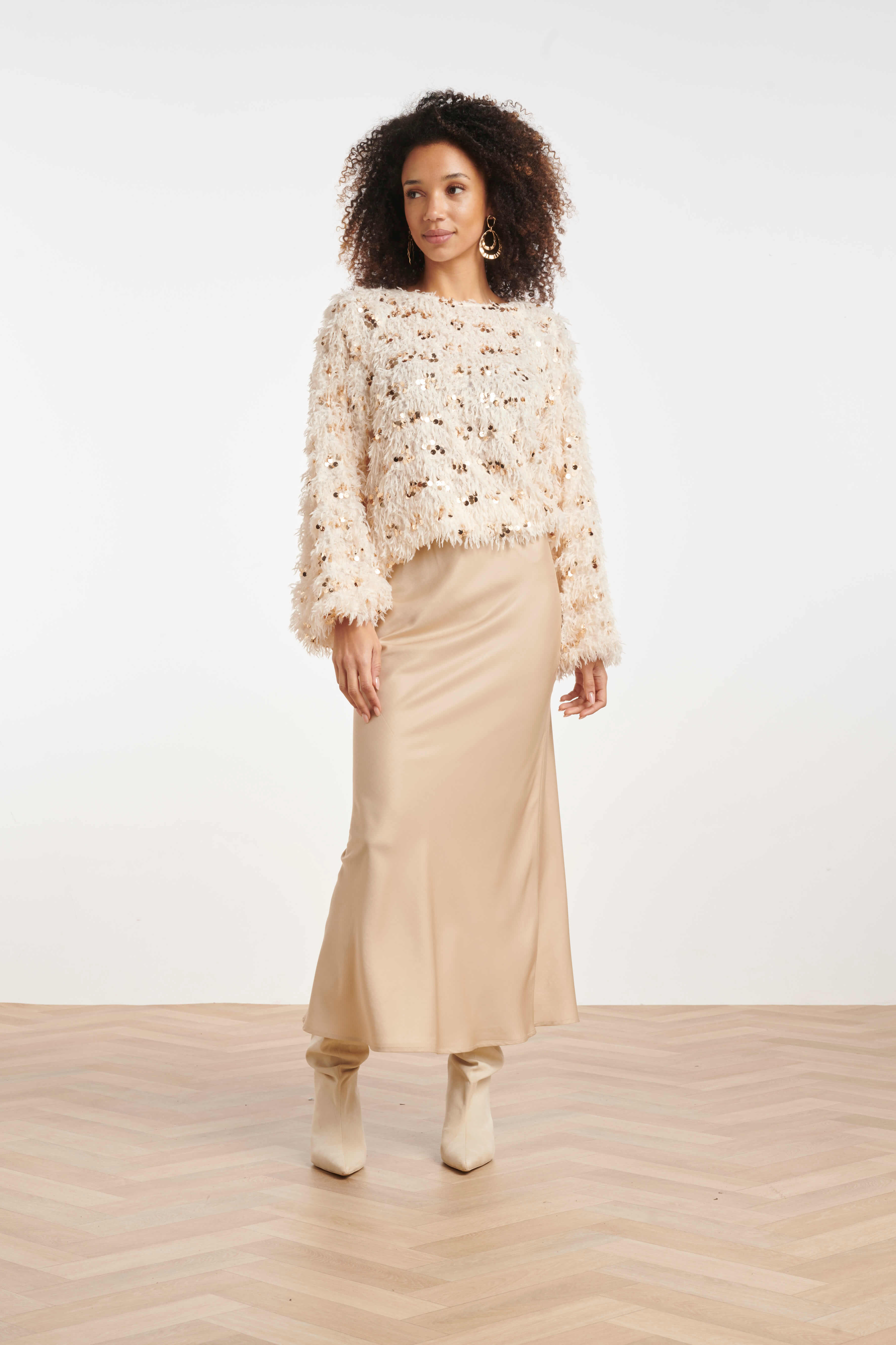Women’s statement top with feathered texture and scattered sequins