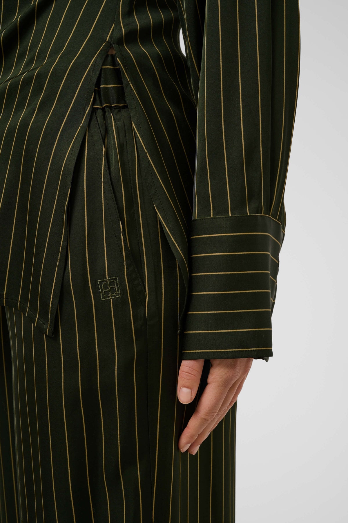 Close-up of the Cinna Trousers’ vertical pinstripe pattern