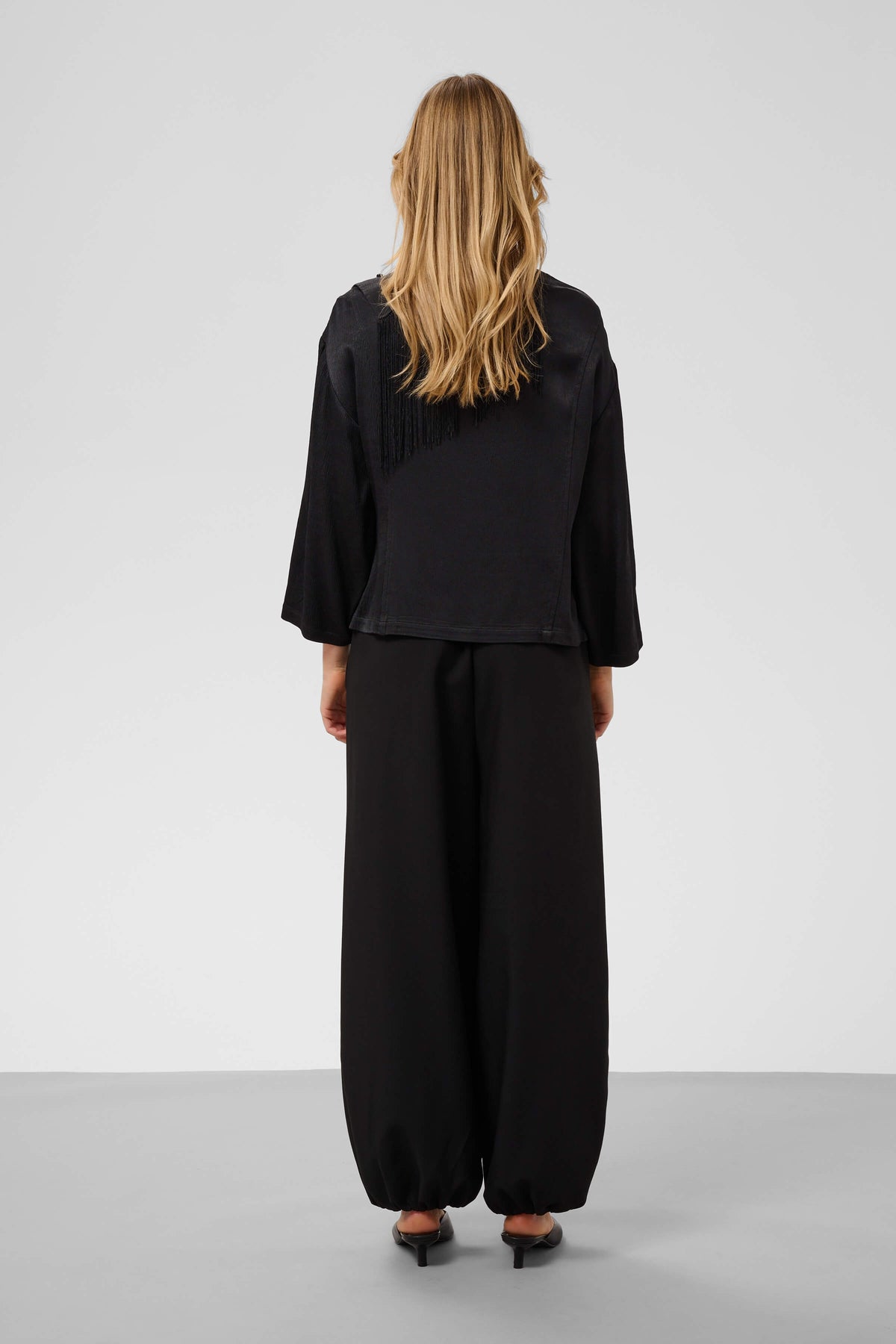Rear view of the Mirabella relaxed-fit blouse with three-quarter sleeves