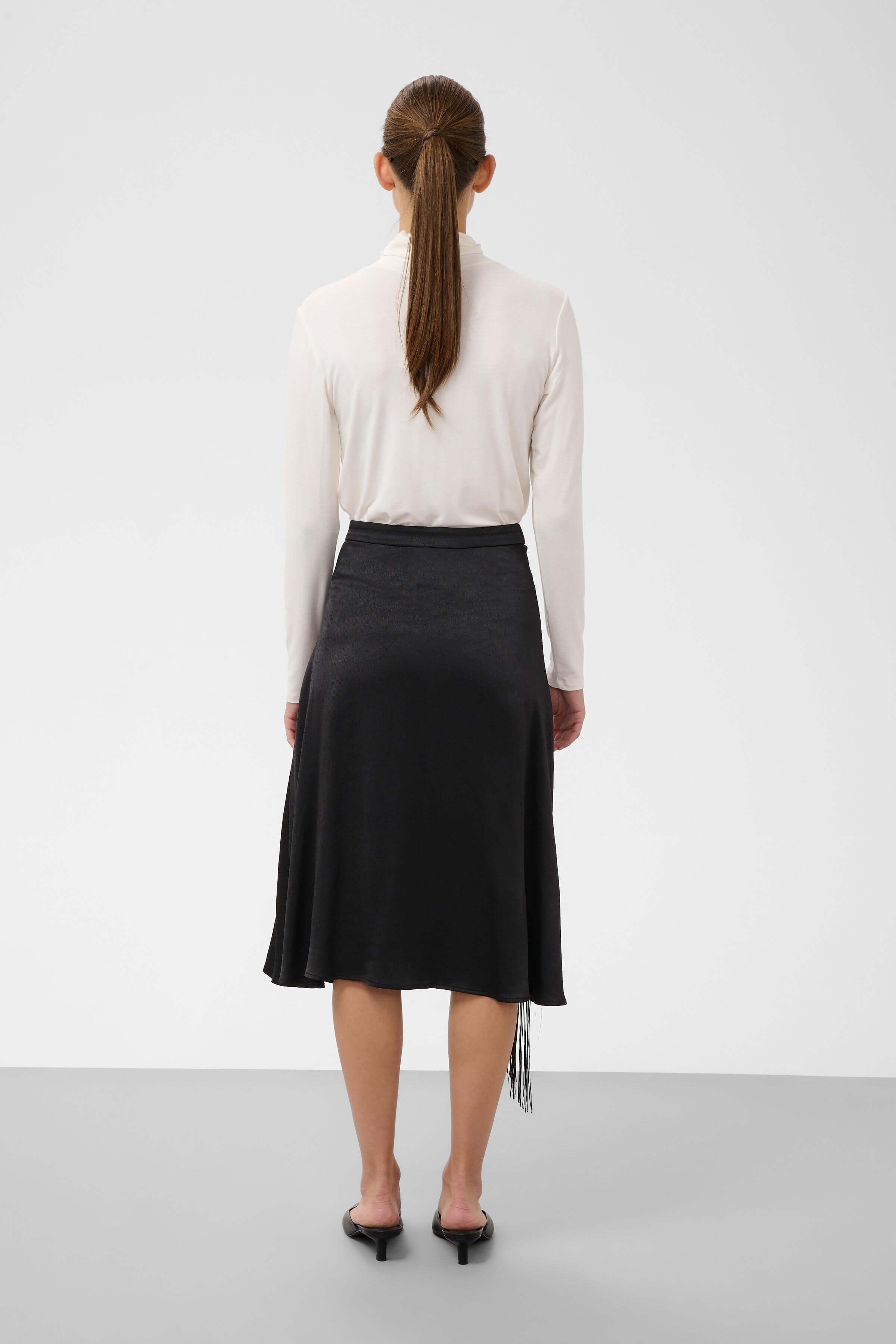 Mirabella straight midi skirt with asymmetric fringe trim