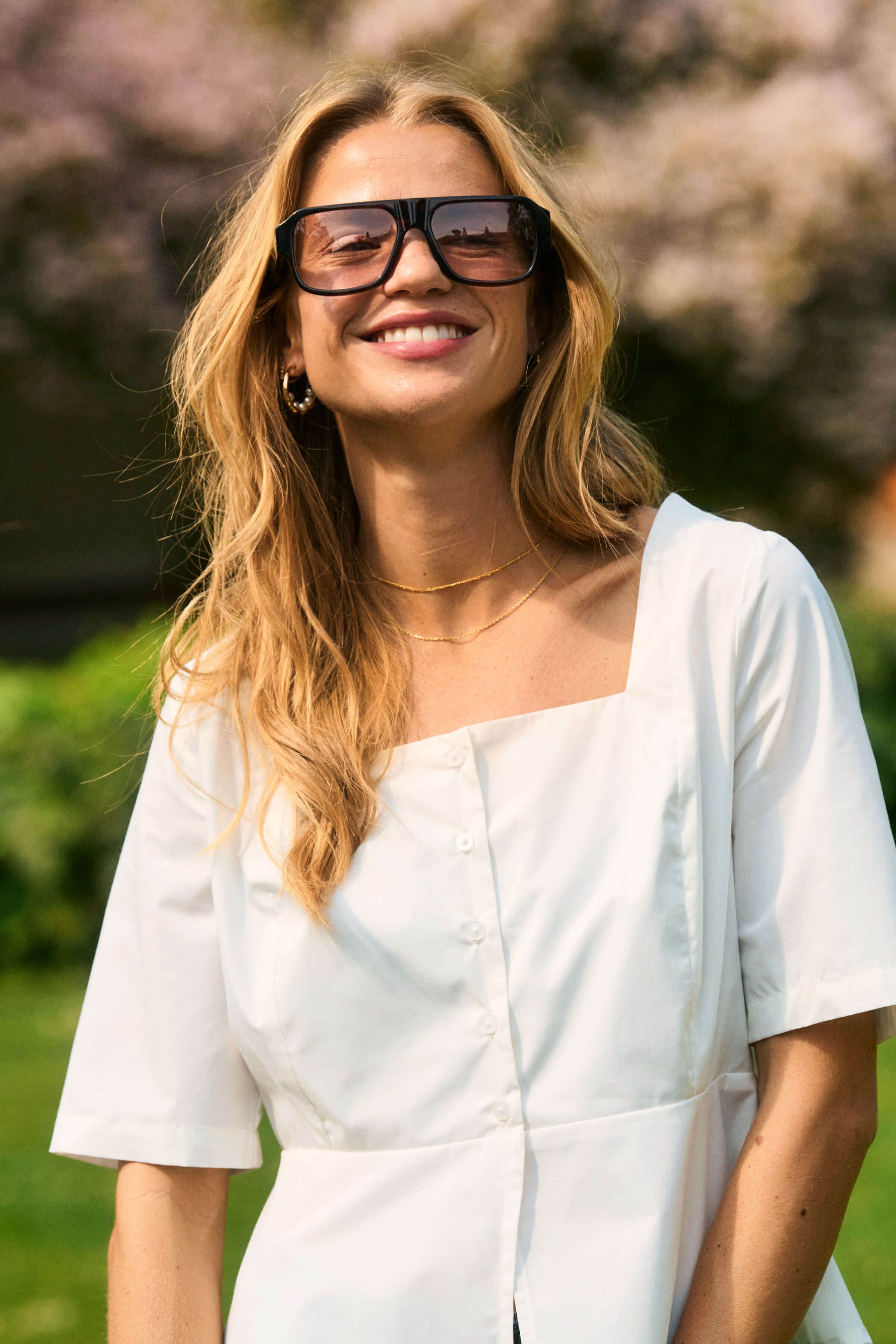 A crisp white blouse with a square neckline