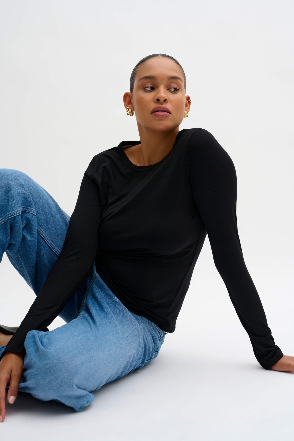 Model wearing the 18 The Modal Blouse with a slim silhouette