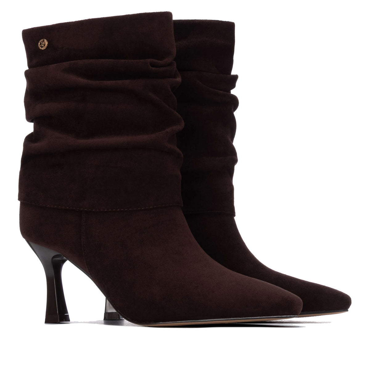 A pair of dark brown slouchy ankle boots with pointed toes and slim black kitten heels.