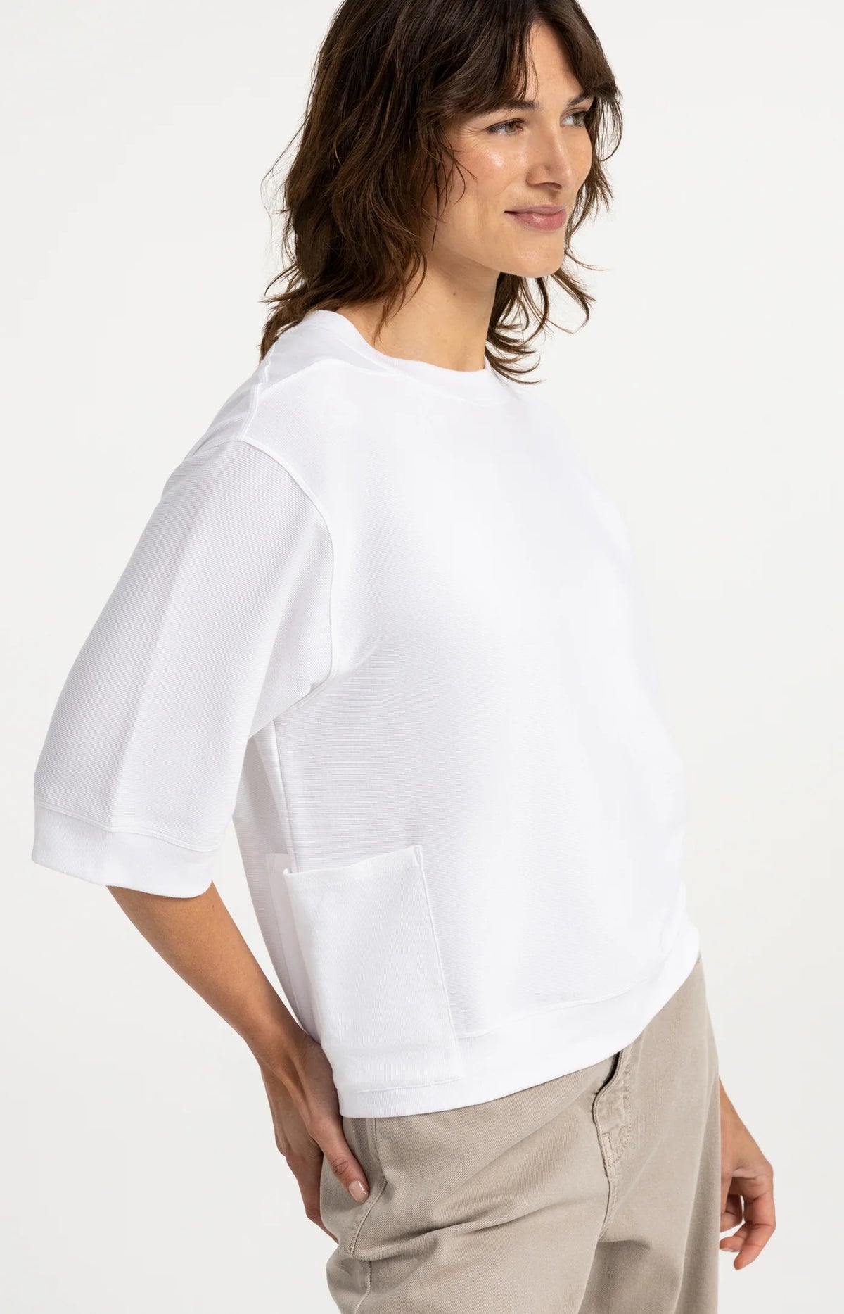 Detail view of YAYA top with ribbed hem and side pocket