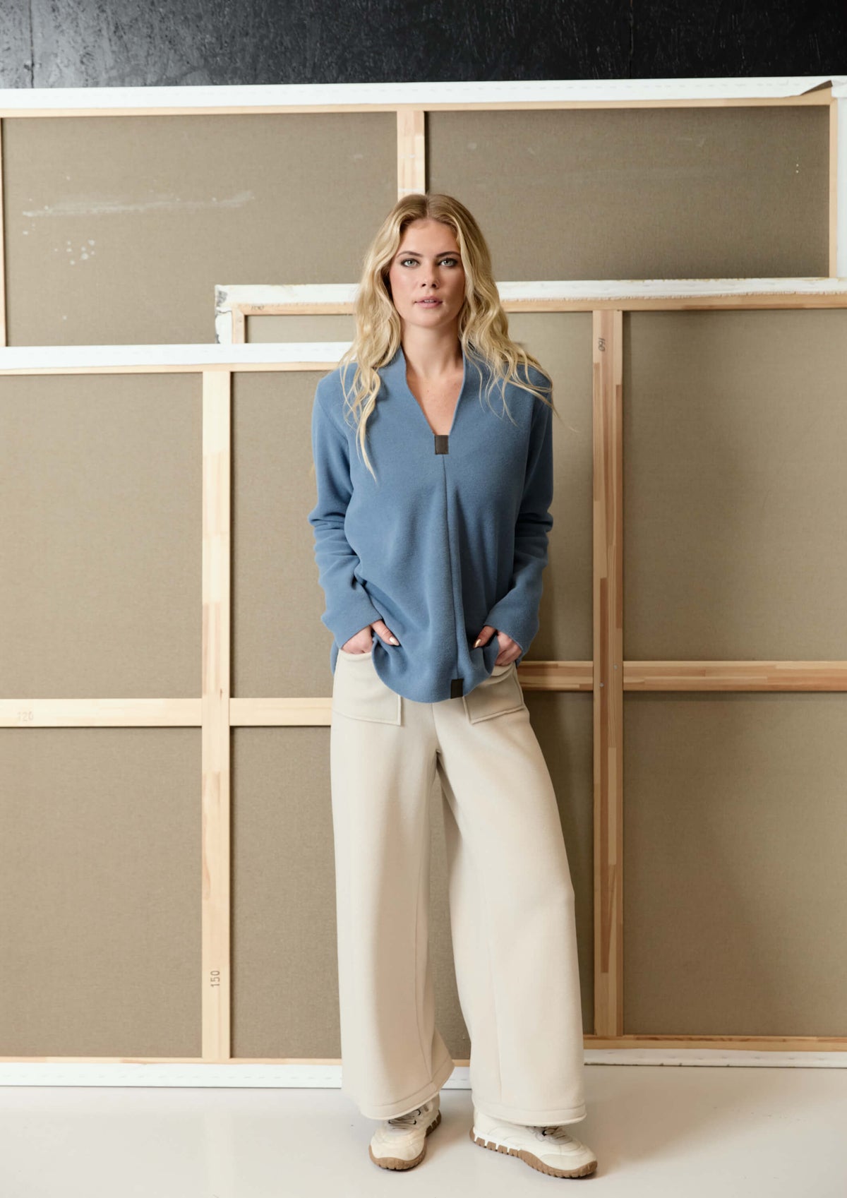 Front view of the HSCPH Flare Trousers with contrasting hem details