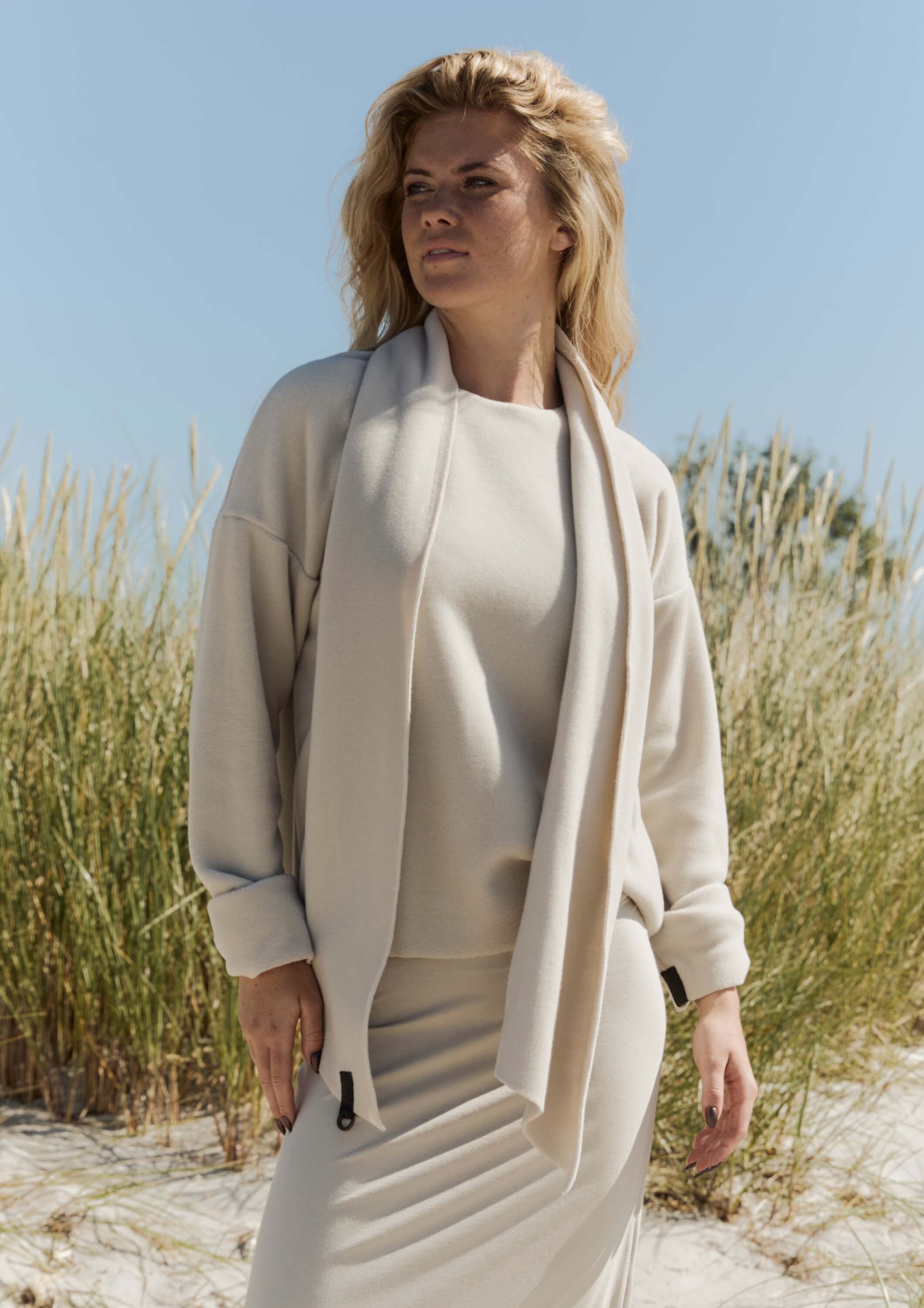 A woman wearing an outfit with Henriette Steffensen scarf.