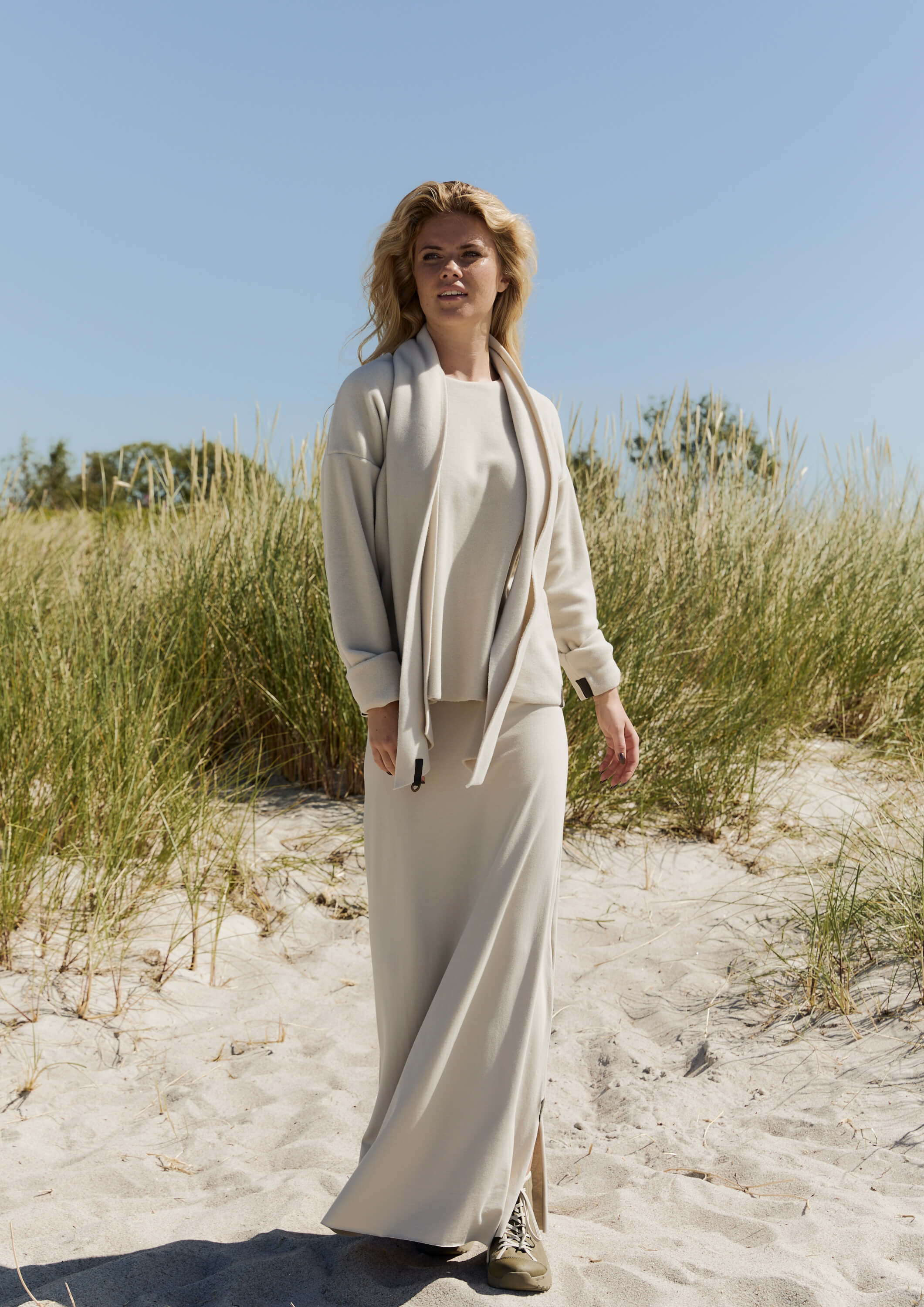 A woman wearing an outfit with Henriette Steffensen small scarf.