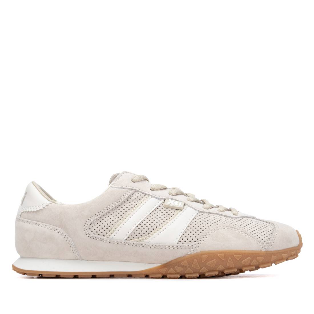 Grey sneaker with a brown gum sole 