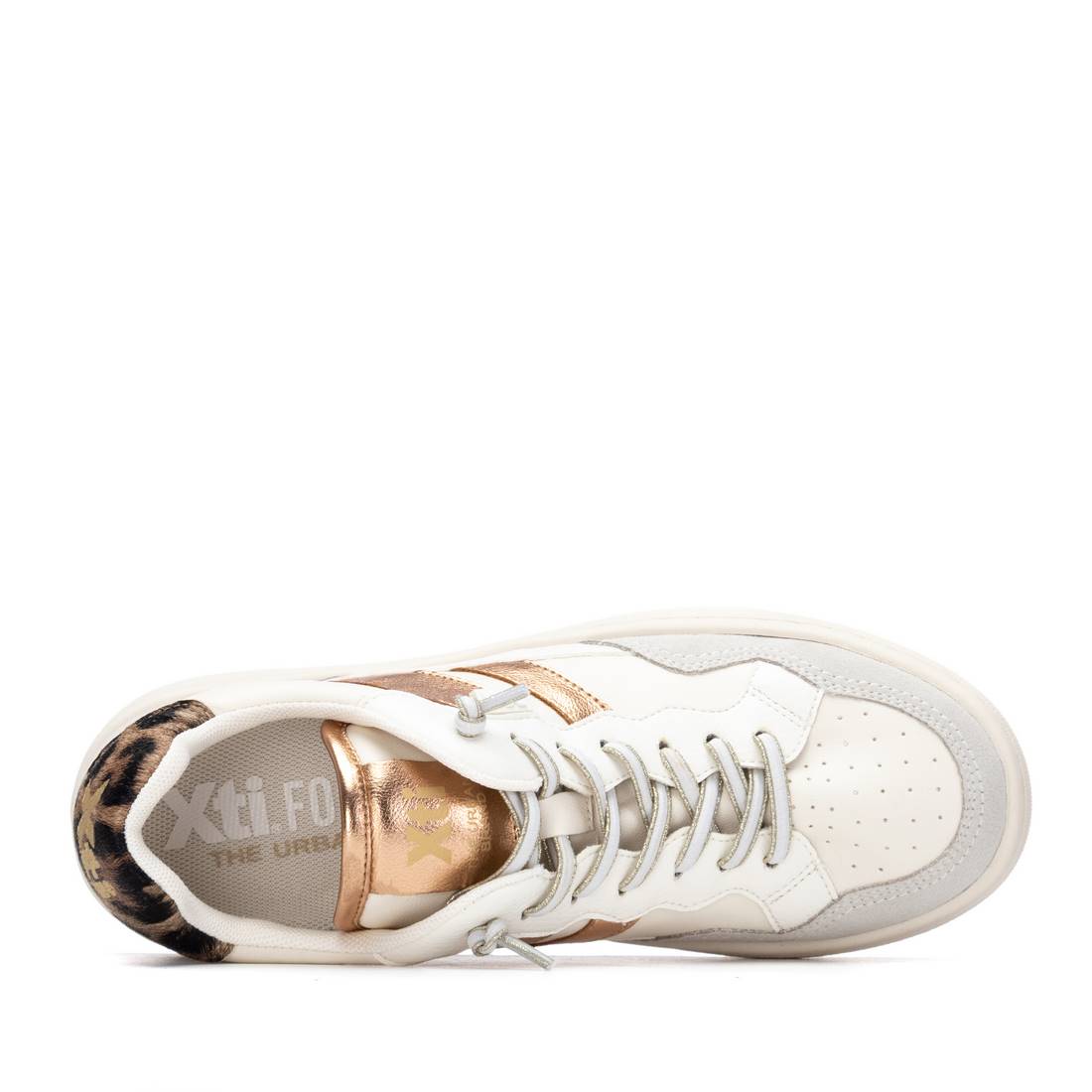 White sneaker with gold accents and elastic laces
