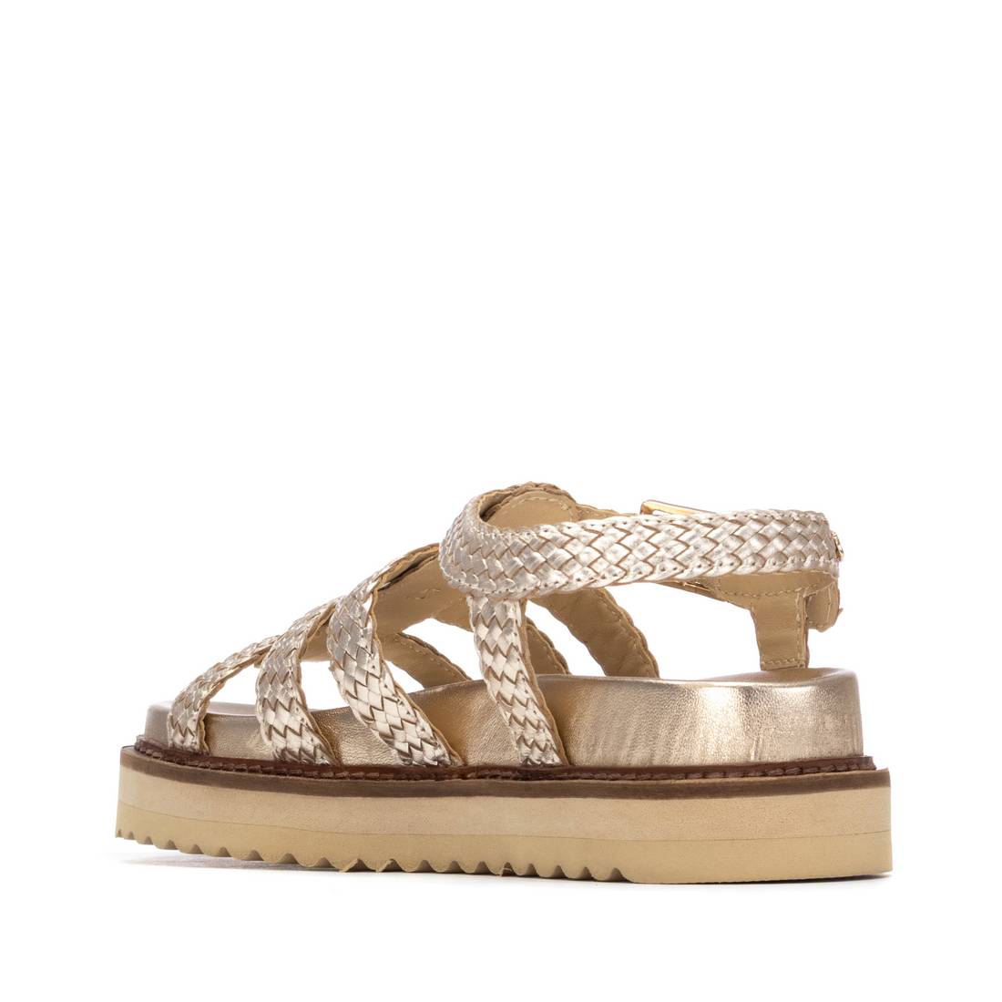 Gold sandal with woven straps on a chunky sole