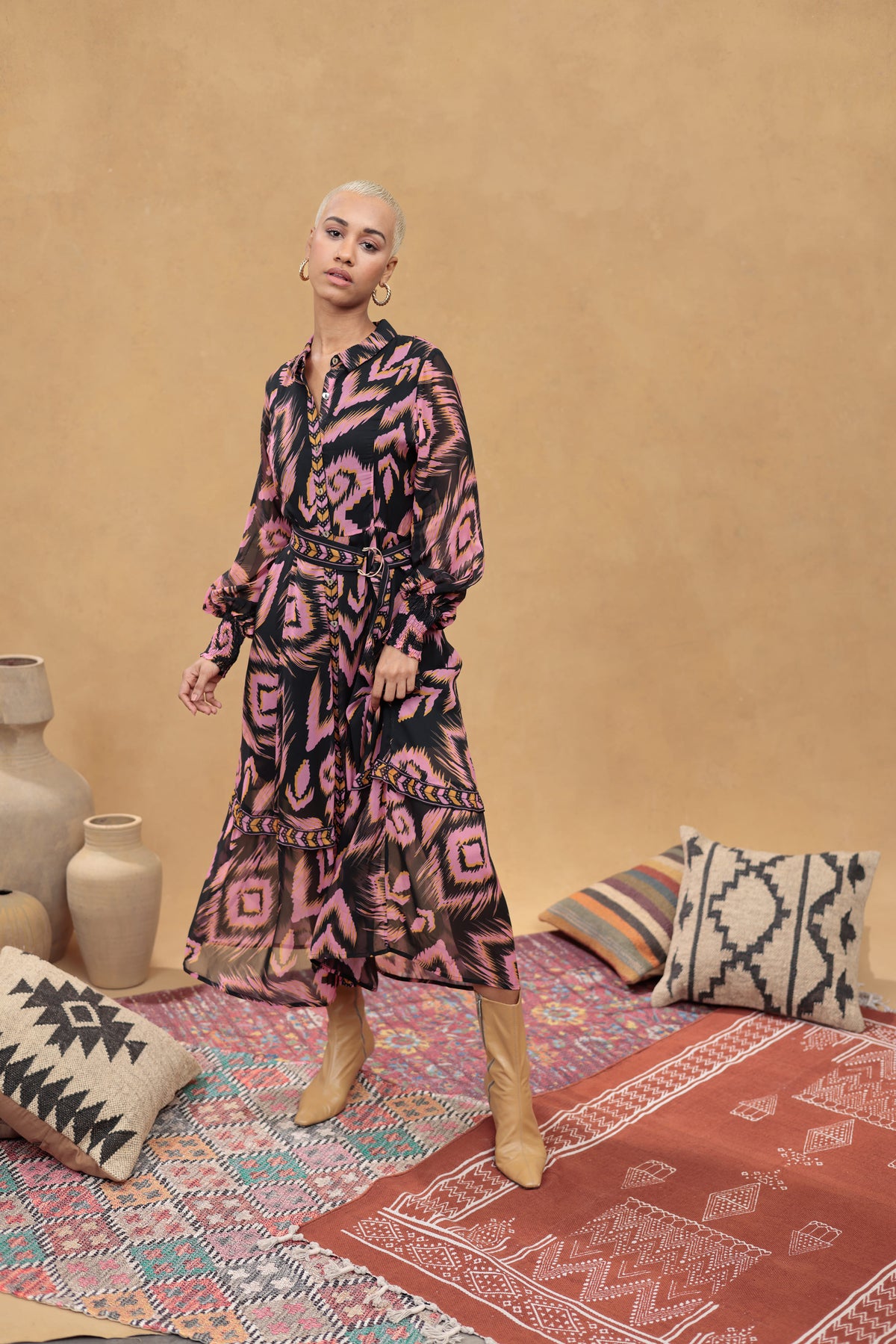 Model wearing the Emily Lovelock June abstract-print belted maxi dress