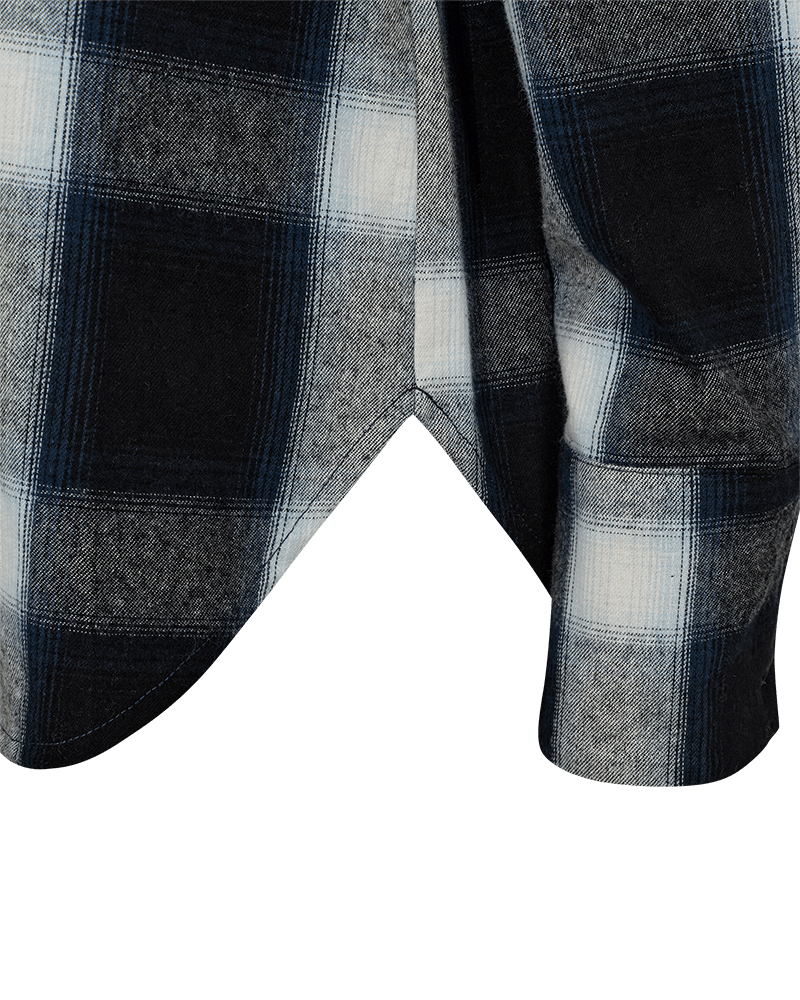 Close-up of Freequent women’s loose-fit checked shirt with a rounded hem