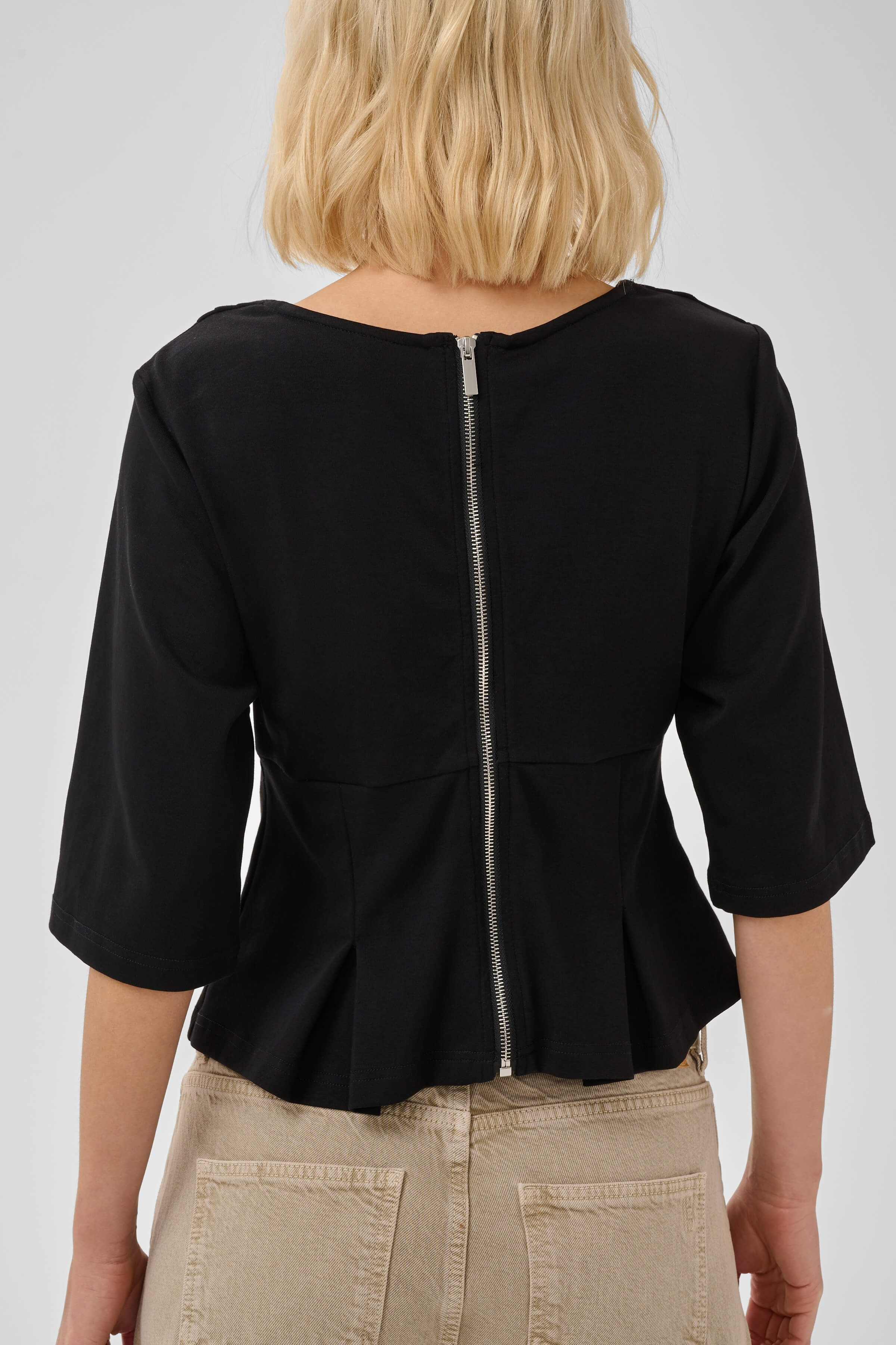 Back view of the MWApir T-shirt with rear zip closure
