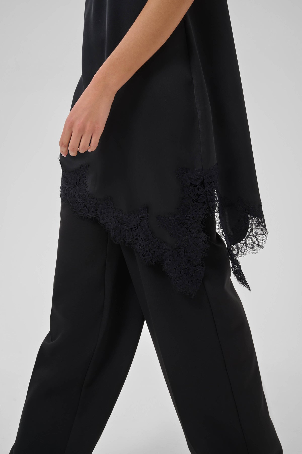 Women’s draped satin dress with delicate lace detail