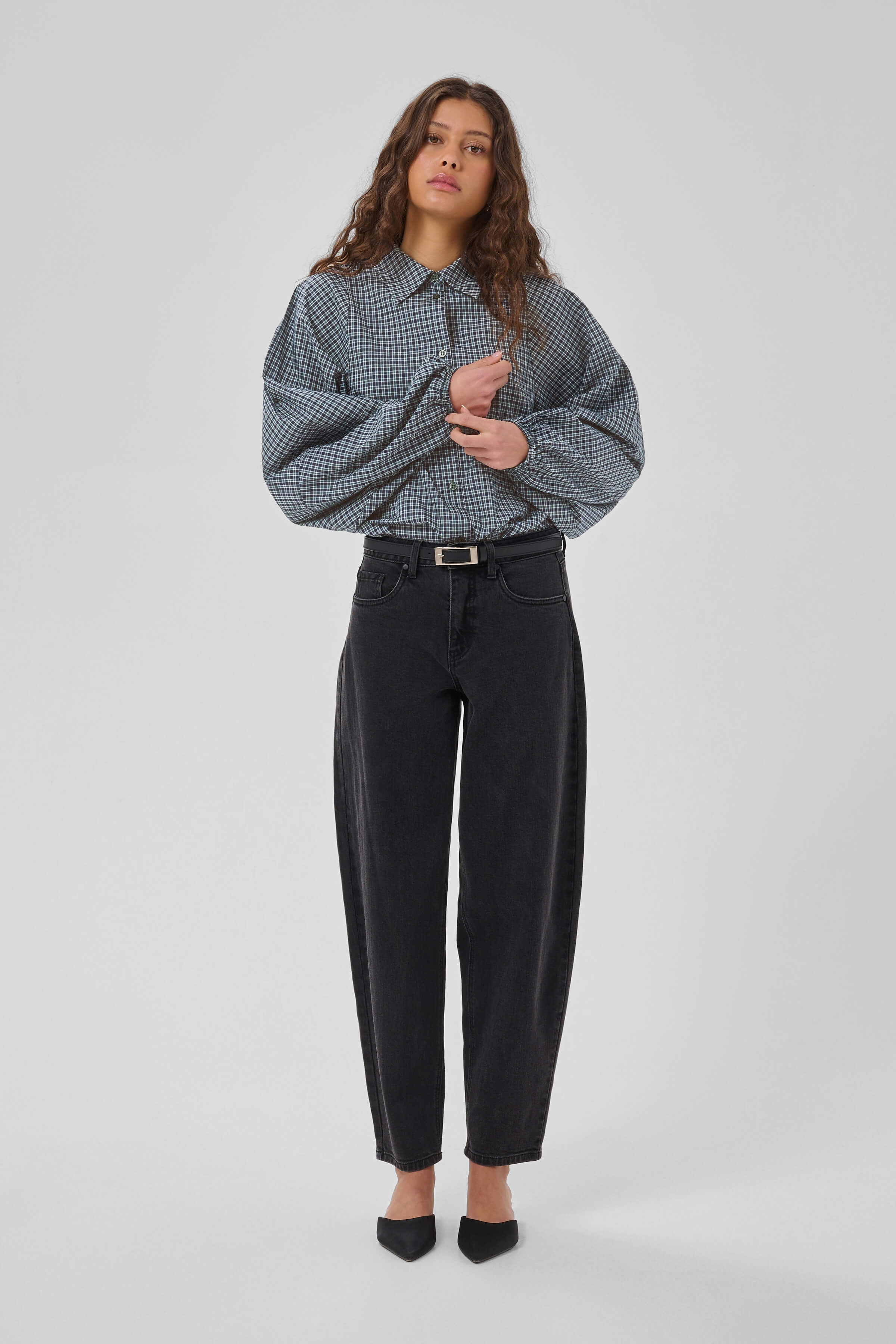 Model wearing the MWIlse checked button-front shirt