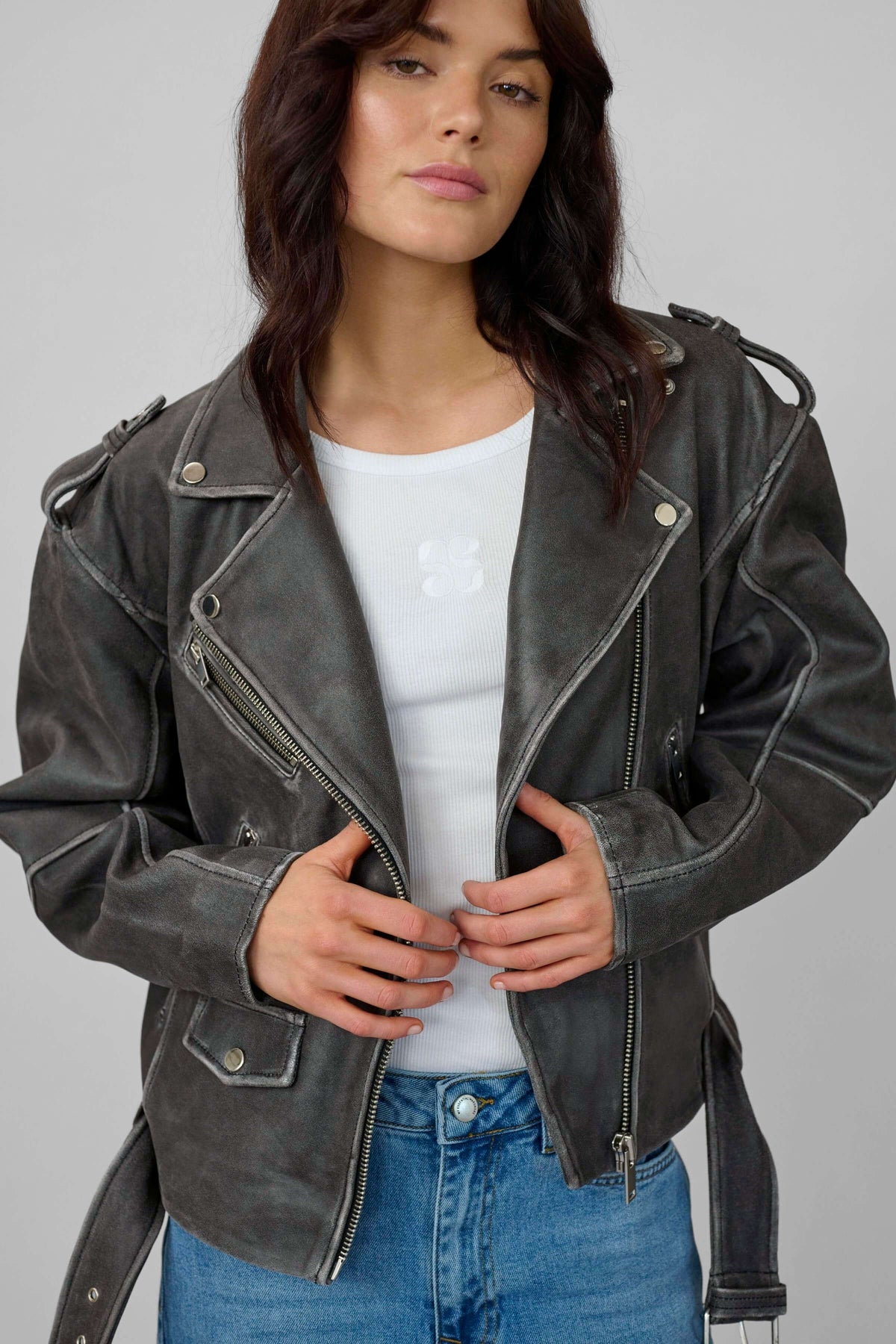Model wearing the Gilo boxy leather biker jacket