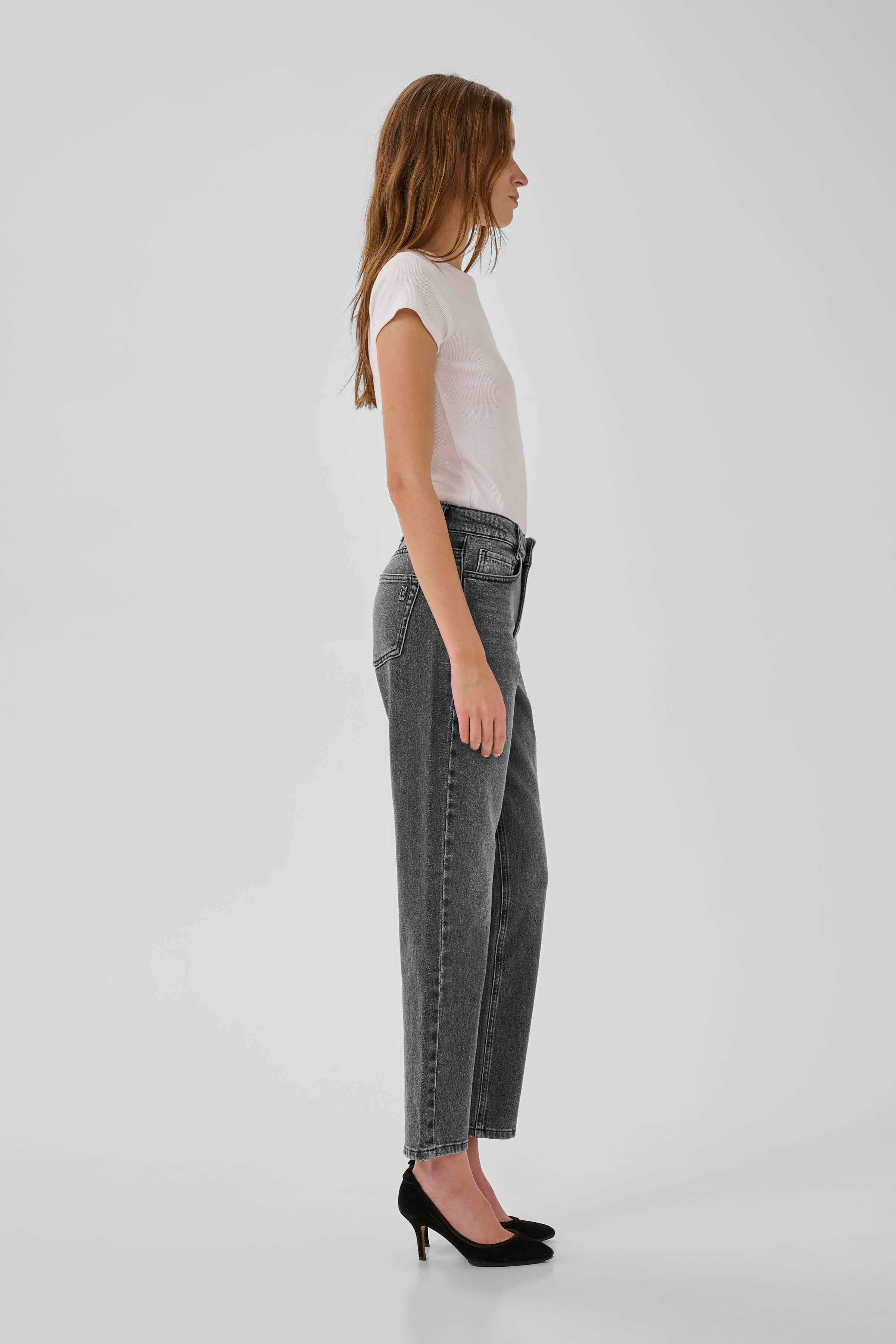 Side view showing the tapered leg of The Mommy Jeans