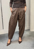DARLING barrel-leg faux leather trousers styled with heels
