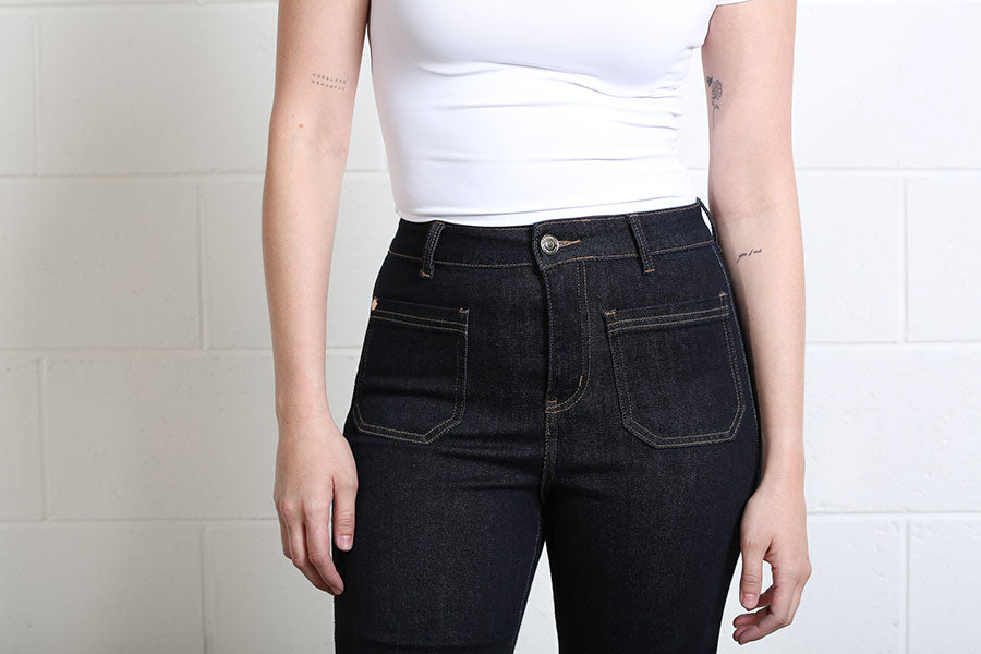 Women’s high-rise flare jeans with statement front pockets by Rant & Rave