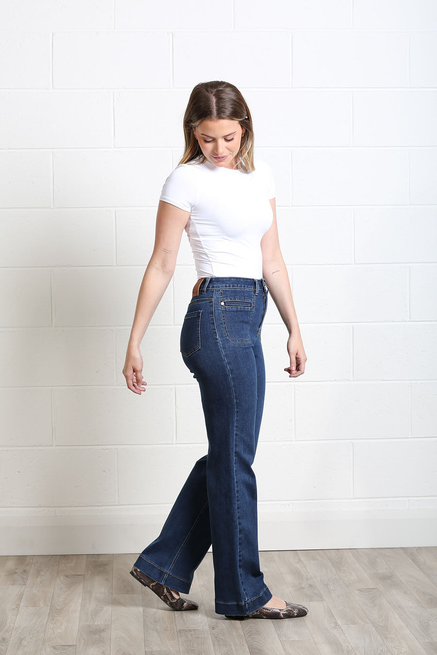 Ada wide-leg jeans styled with a fitted top and flats