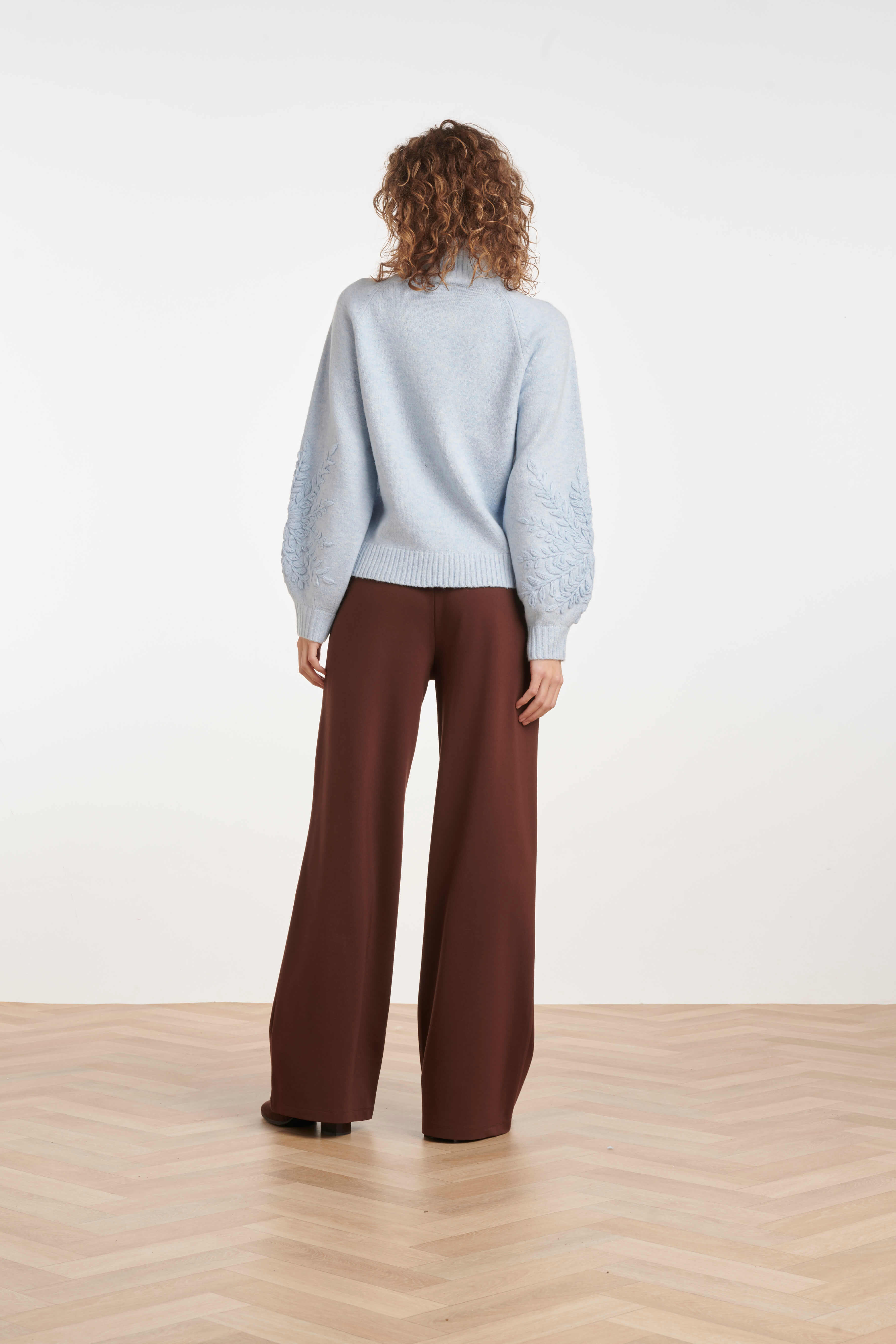 Smashed Lemon statement knit with textured leaf motifs on the sleeves