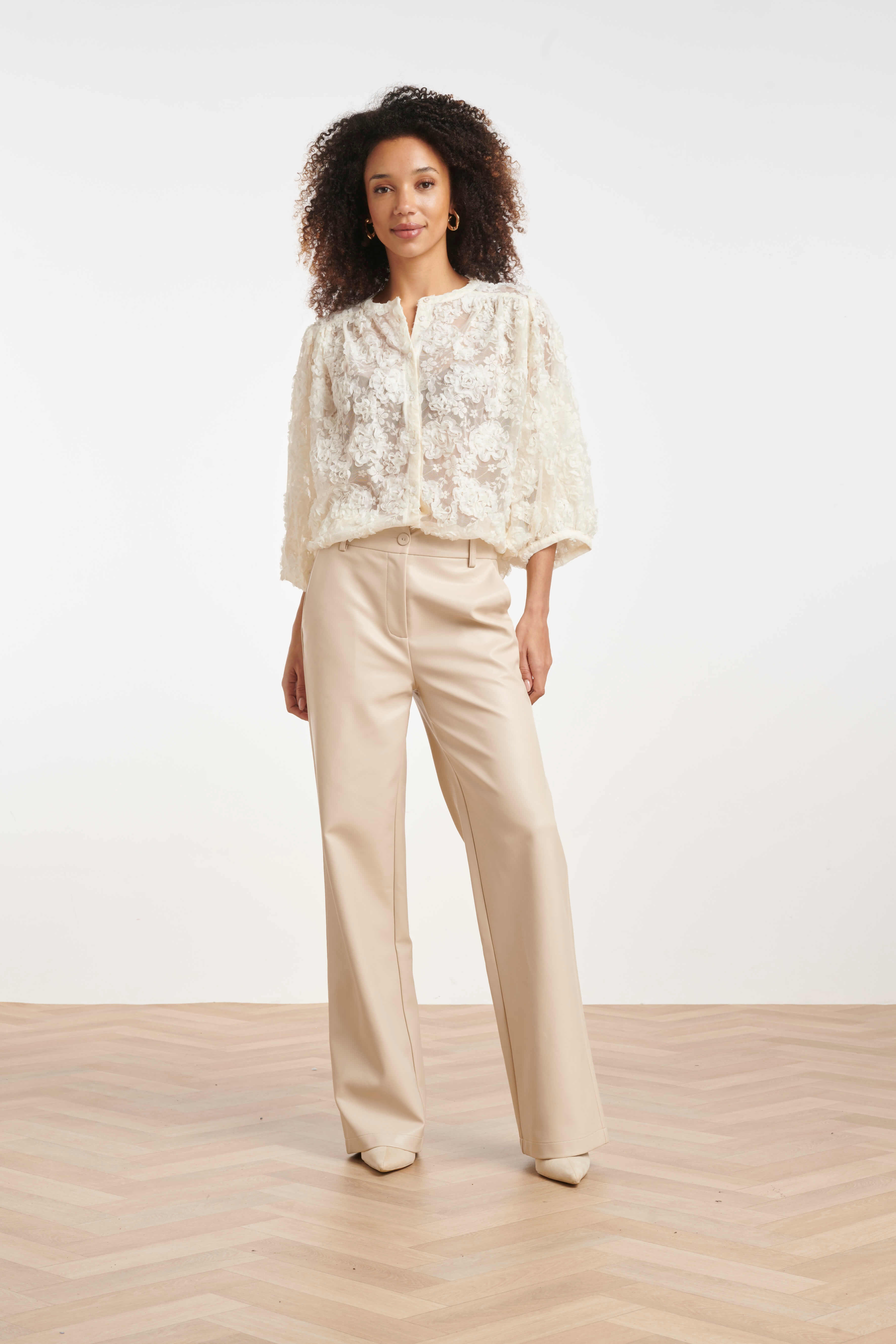 Women’s button-through blouse with raised floral detailing