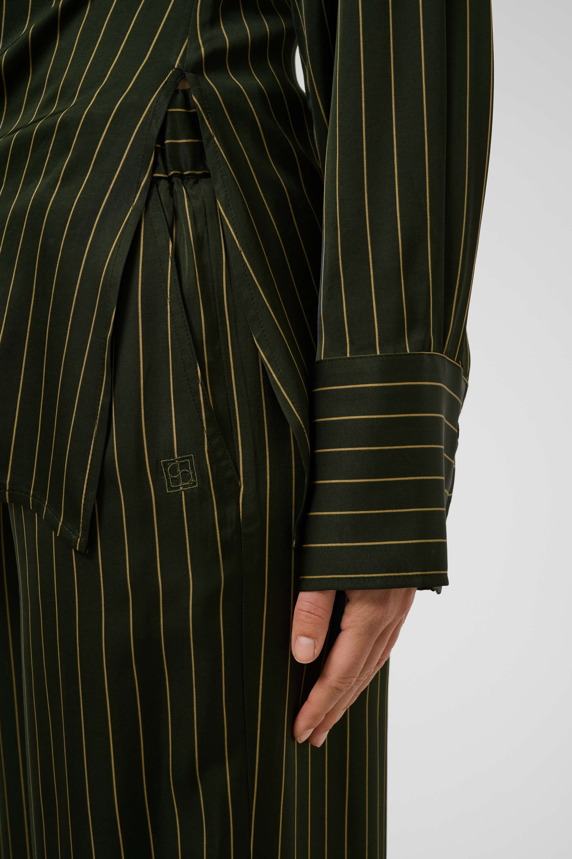 Close-up of the Cinna Trousers’ vertical pinstripe pattern