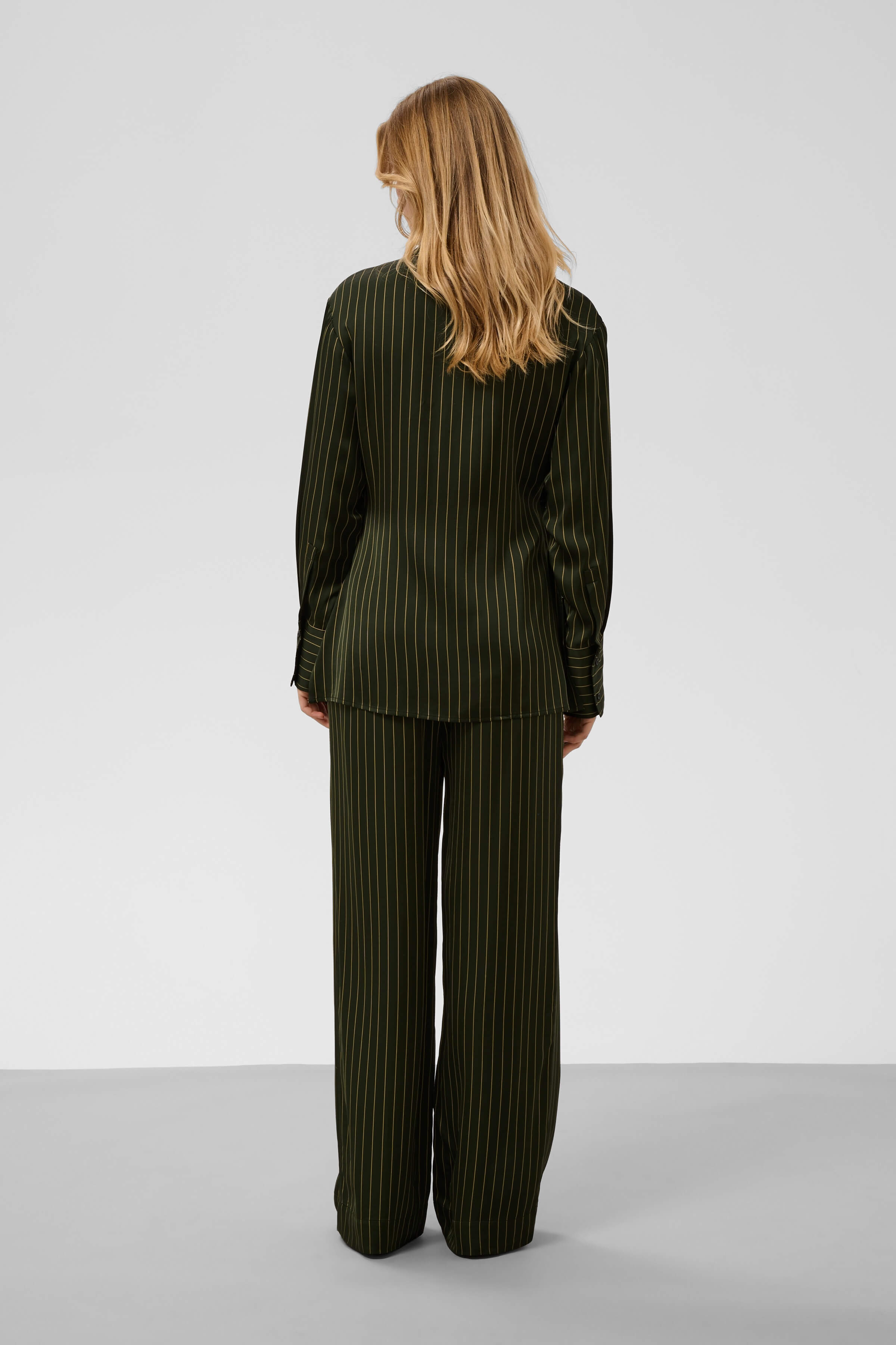 Model wearing the Cinna pinstripe shirt with matching trousers