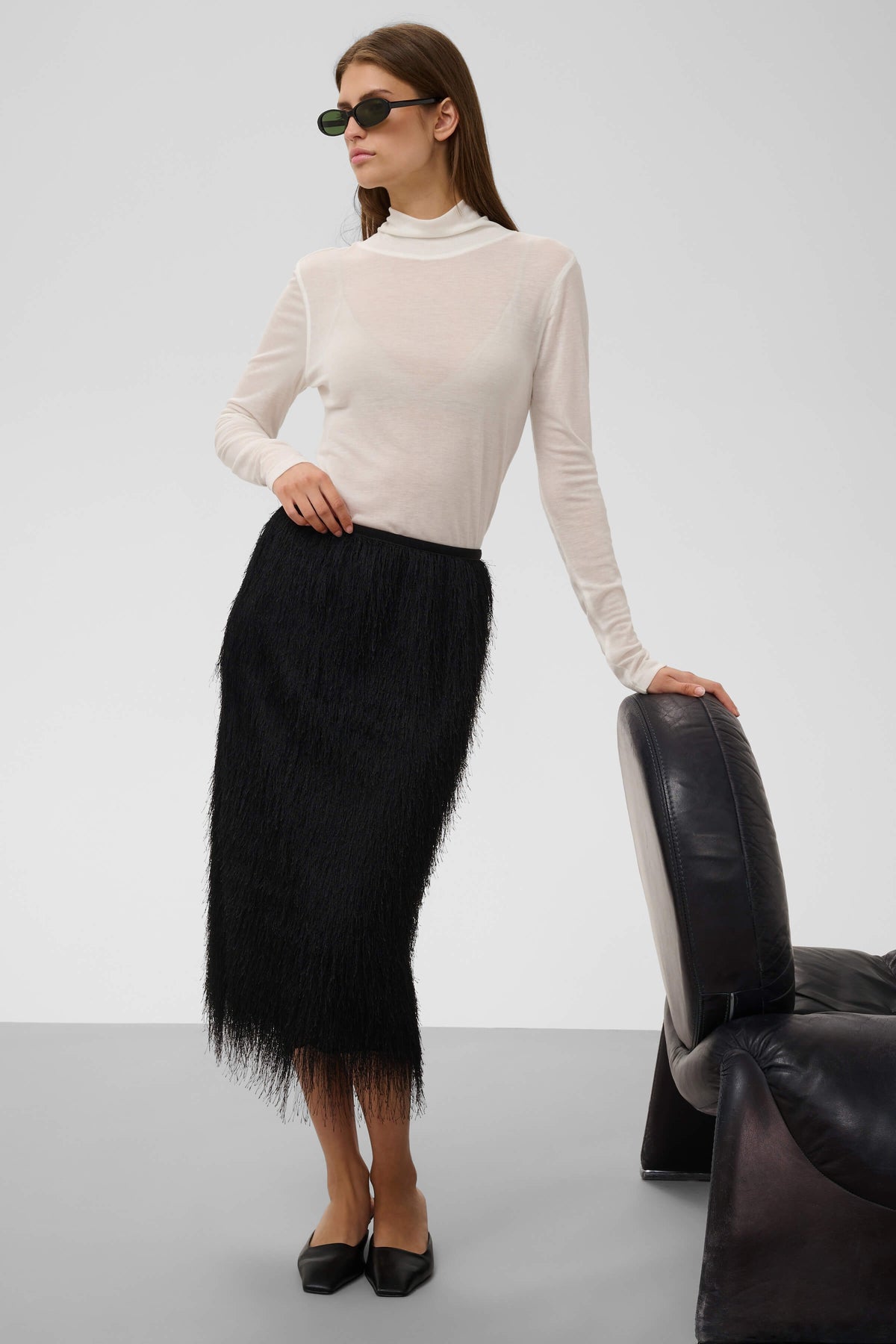 Model wearing the Soaked in Luxury Dacre fringed skirt