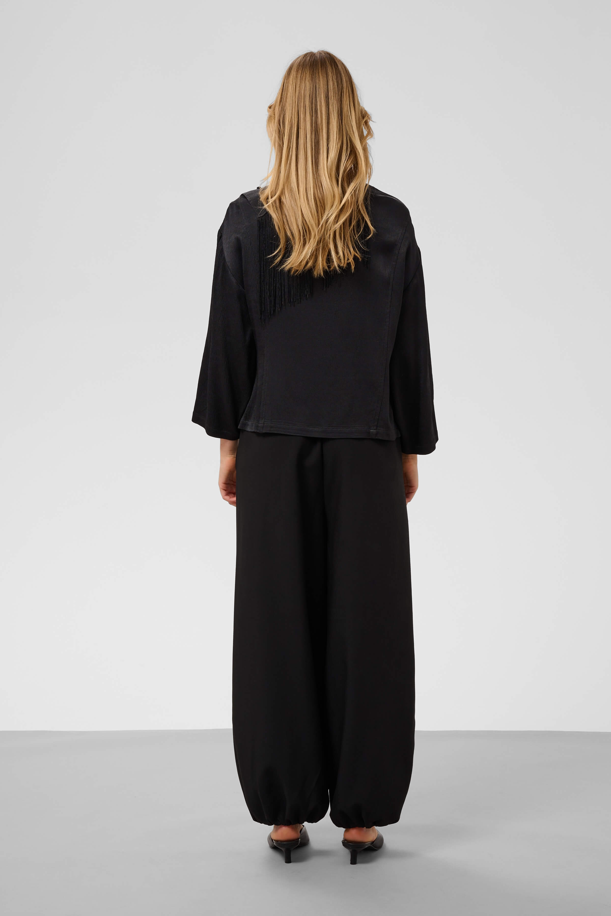 Rear view of the Mirabella relaxed-fit blouse with three-quarter sleeves