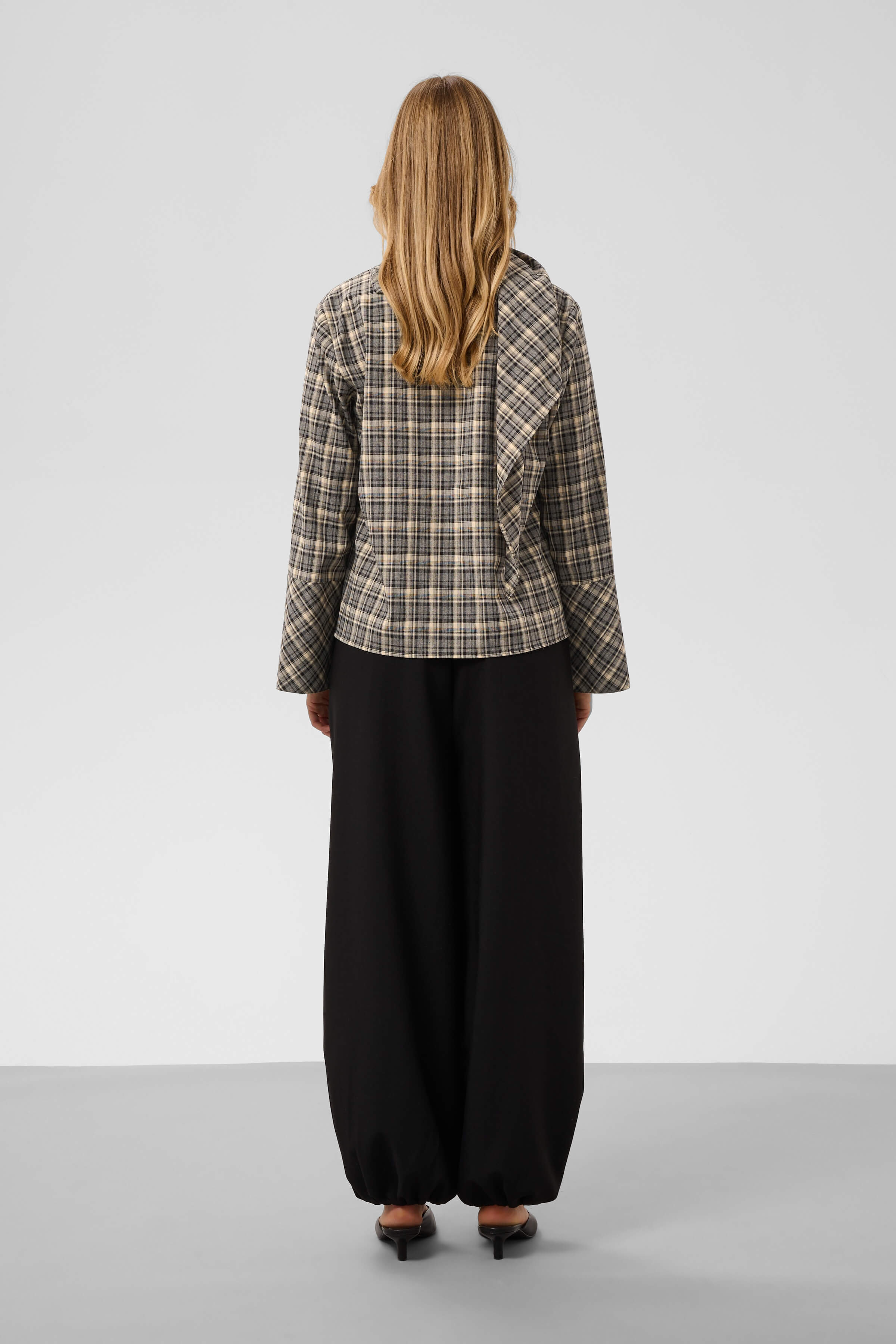 Rear view of the Soaked in Luxury Shiba long-sleeved checked blouse