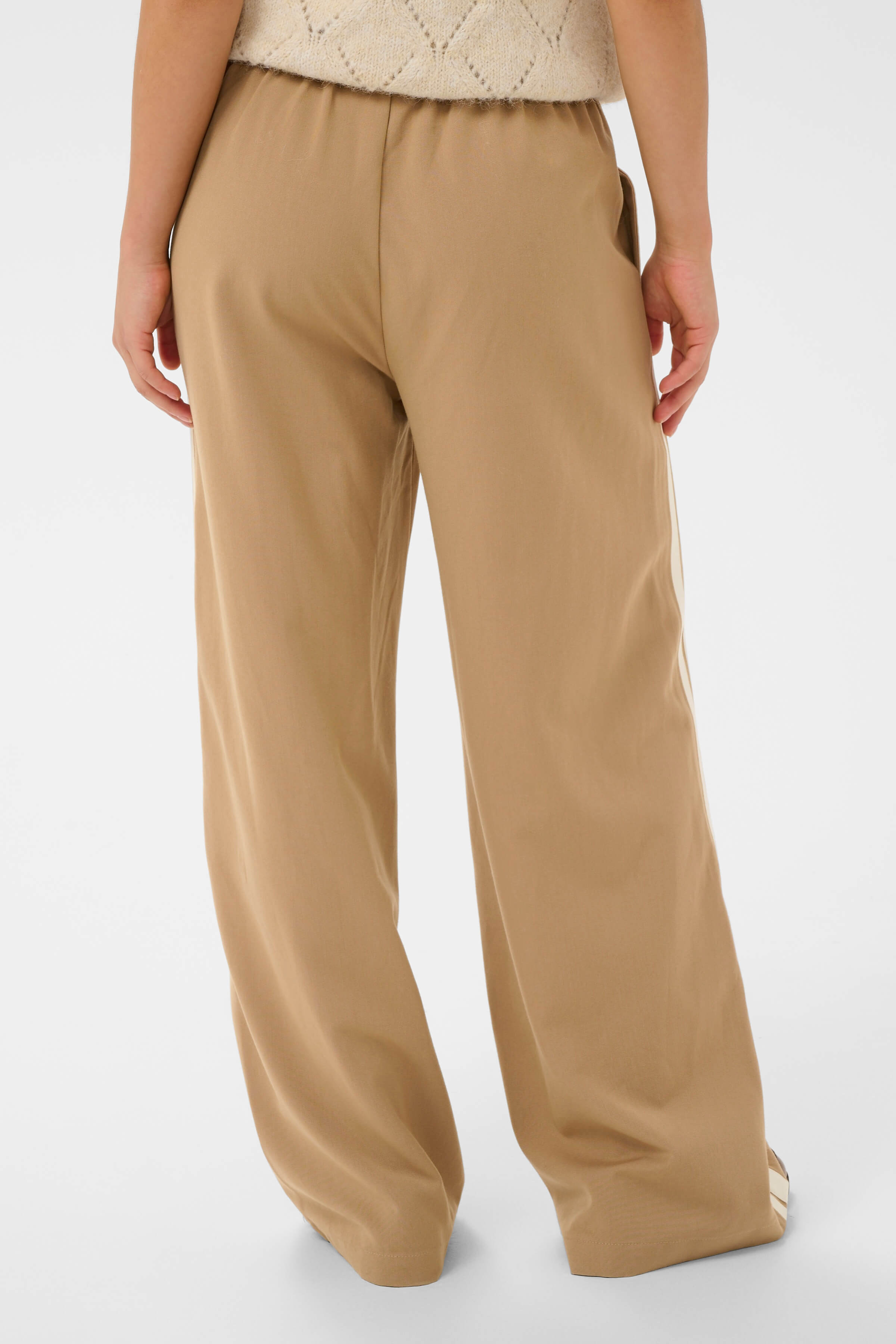 Full-length brown trousers with cream stripes - back view